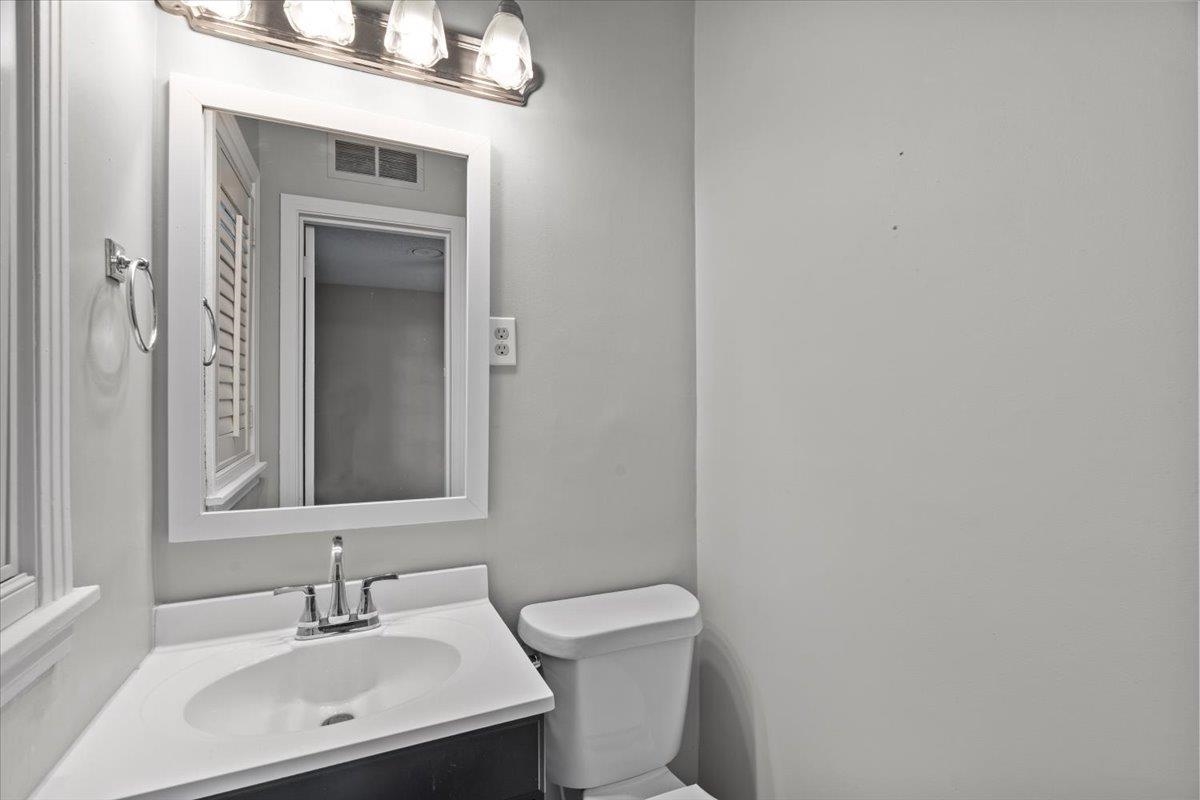 1495 Whitewater Road Memphis, TN 38117 - Photo 15 of 27 a bathroom with a toilet sink and mirror