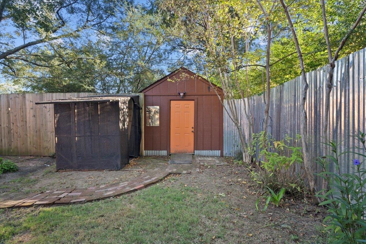 1495 Whitewater Road Memphis, TN 38117 - Photo 24 of 27 a front view of a house with a yard and fence