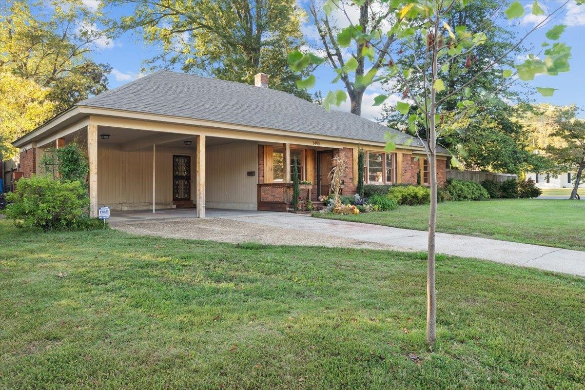 1495 Whitewater Road Memphis, TN 38117 - Photo 27 of 27 a view of a house with a yard and sitting area