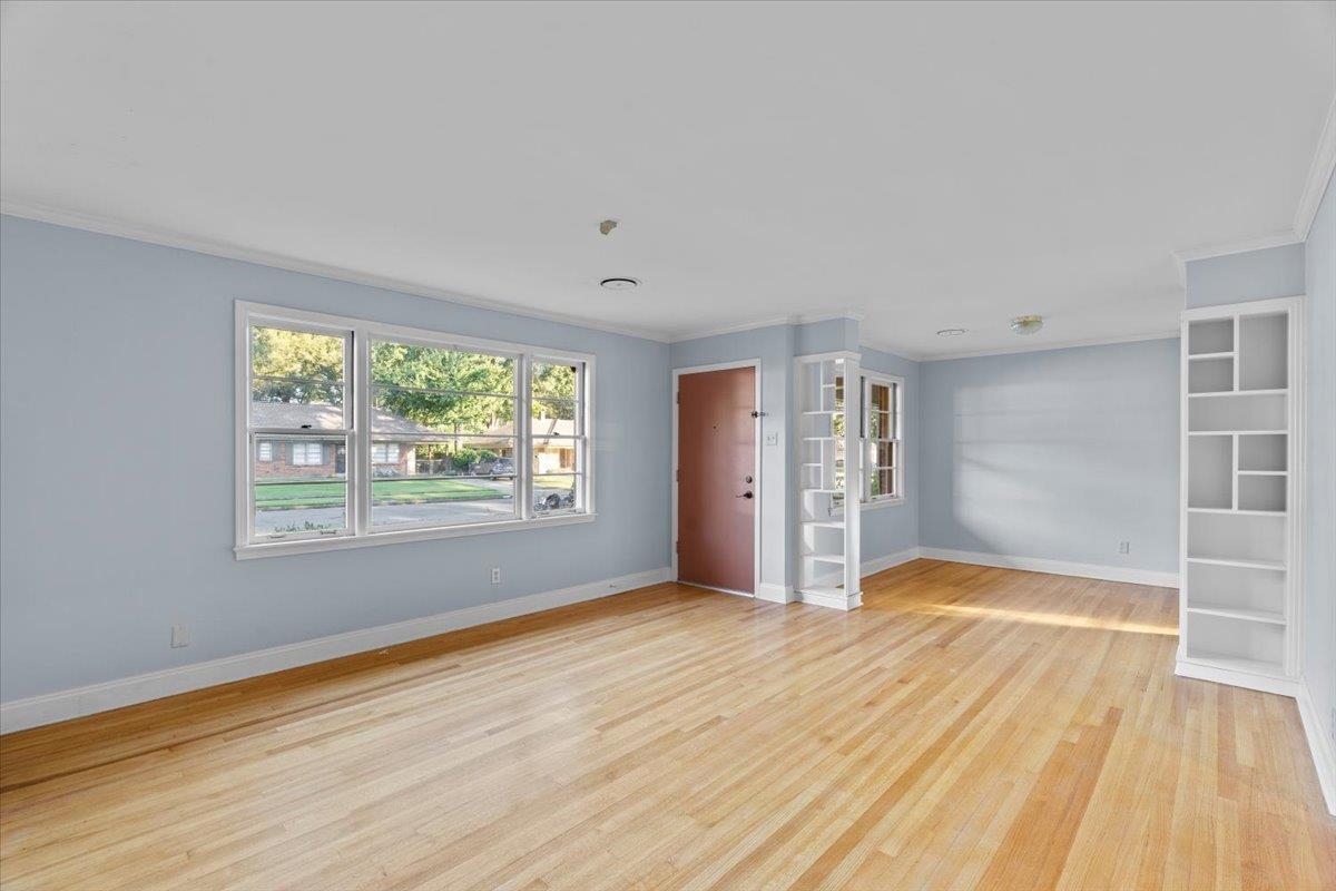 1495 Whitewater Road Memphis, TN 38117 - Photo 4 of 27 a view of empty room with wooden floor and fan