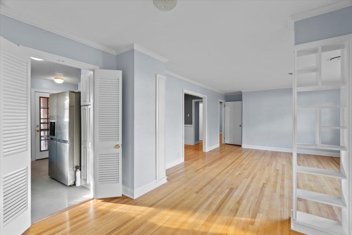 1495 Whitewater Road Memphis, TN 38117 - Photo 5 of 27 a view of empty room with wooden floor and bathroom