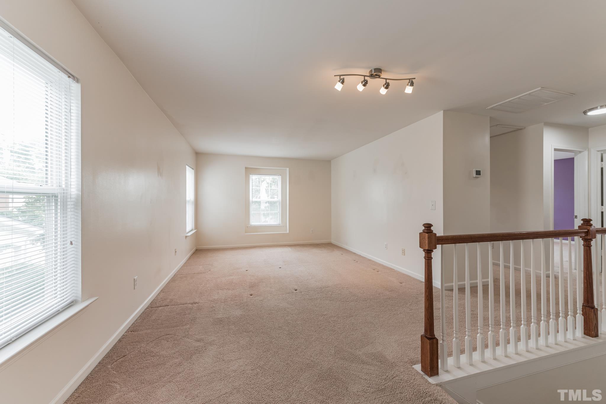 2824 Roundleaf Court Raleigh, NC 27604 - Photo 12 of 35 a view of a livingroom with windows