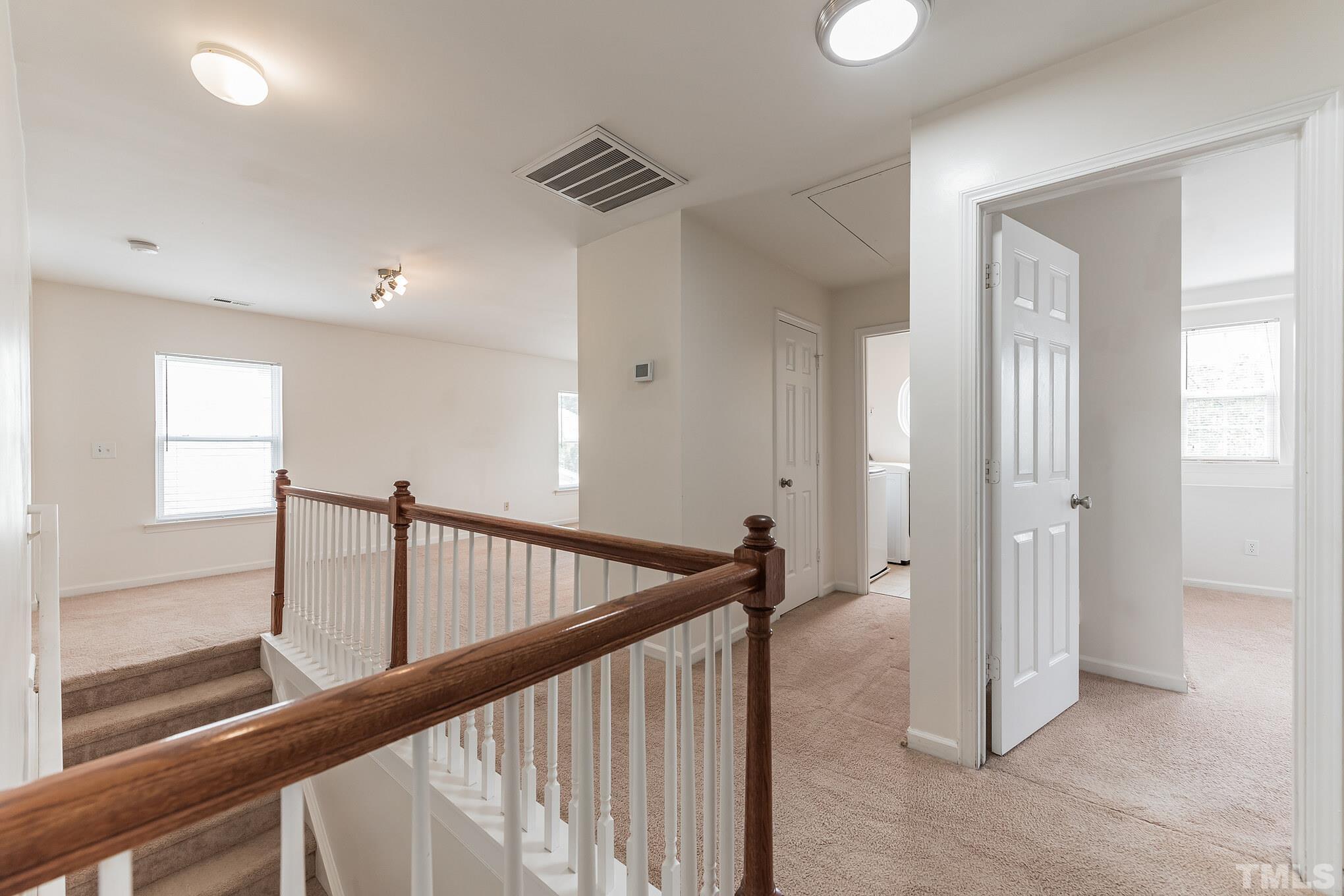 2824 Roundleaf Court Raleigh, NC 27604 - Photo 13 of 35 a view of hallway with stairs
