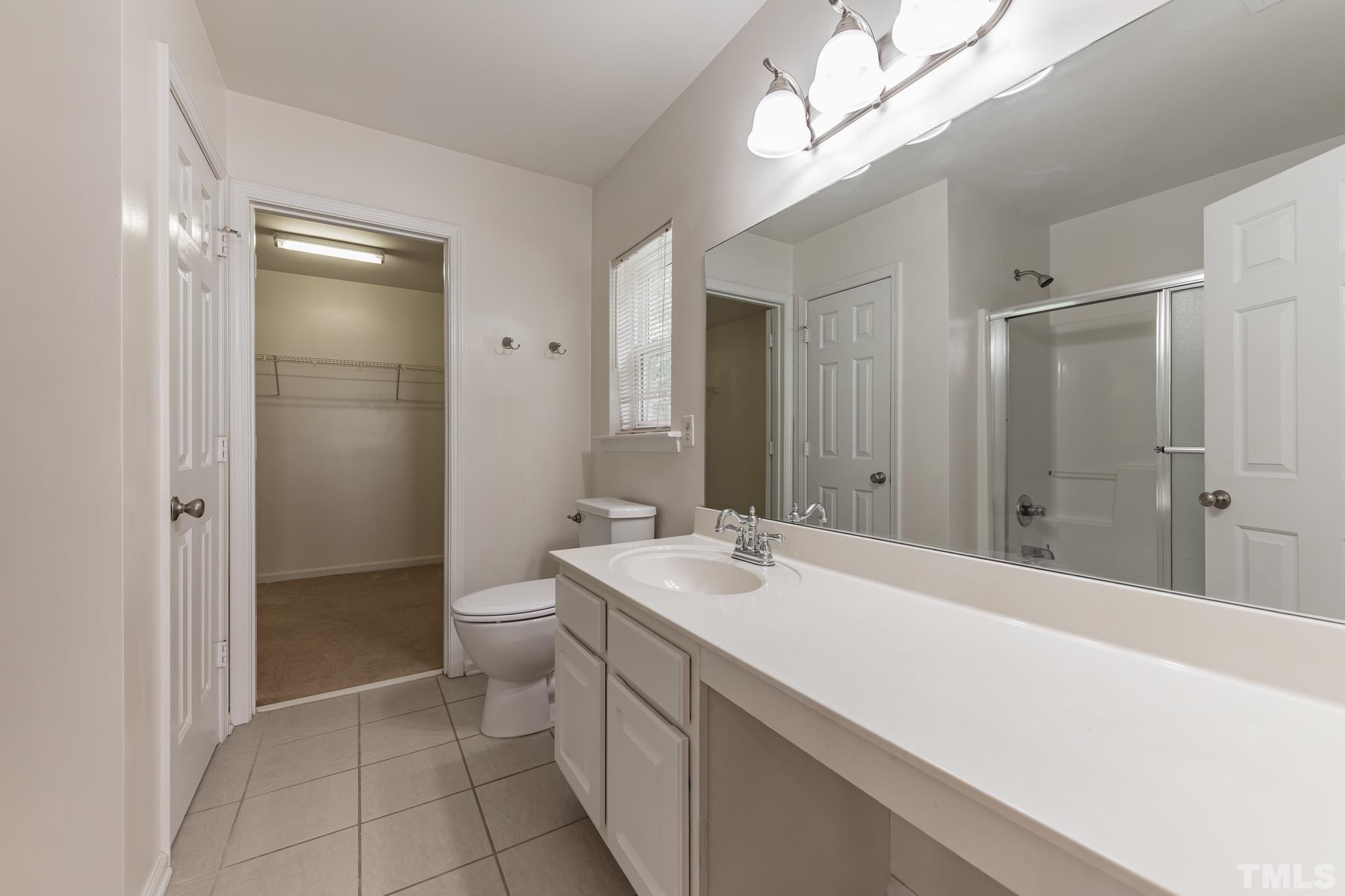 2824 Roundleaf Court Raleigh, NC 27604 - Photo 16 of 35 a bathroom with a sink a toilet and shower