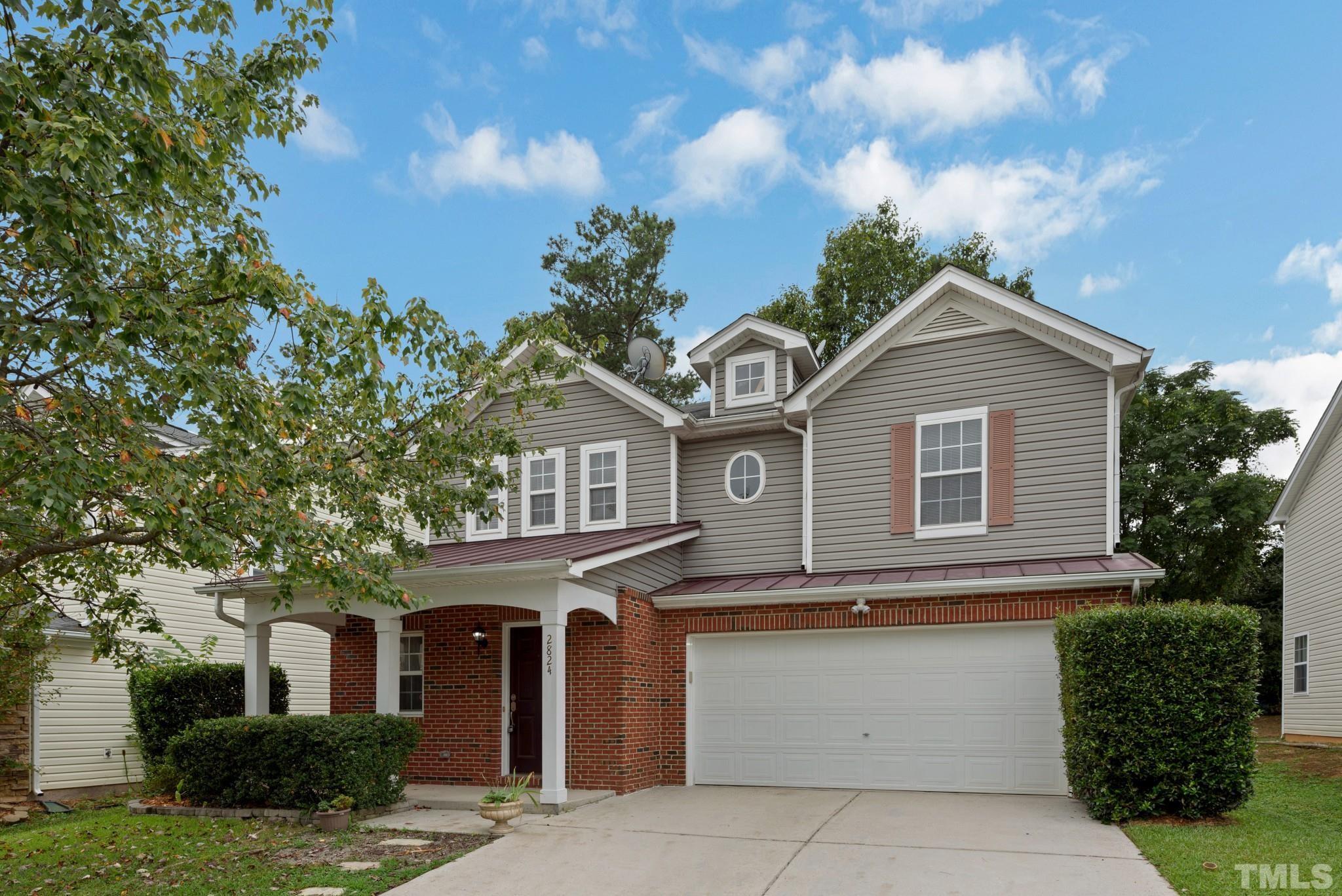 2824 Roundleaf Court Raleigh, NC 27604 - Photo 2 of 35 a front view of a house with a yard
