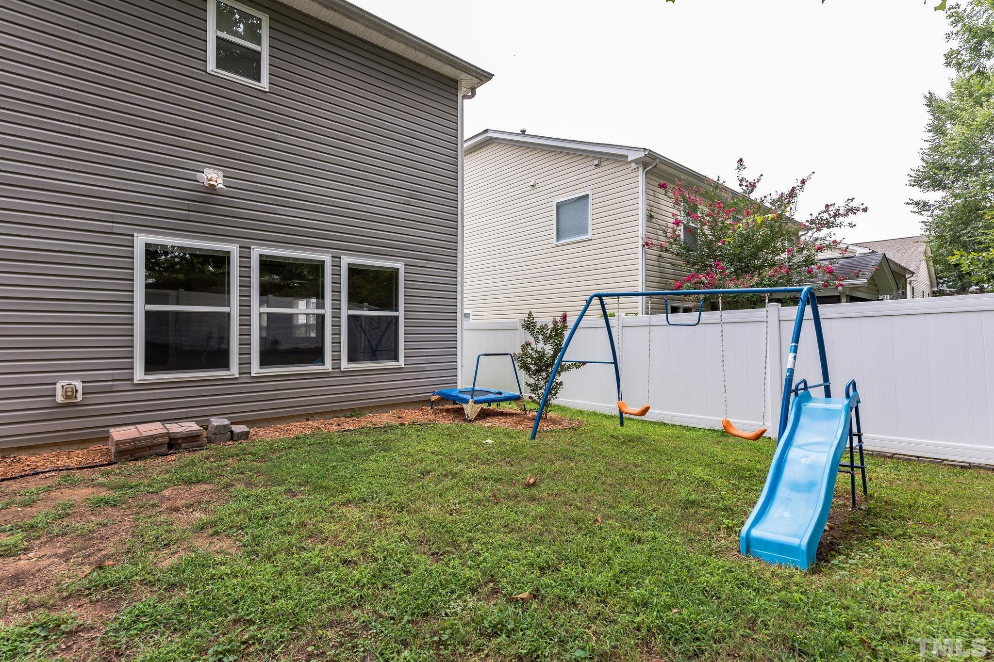 2824 Roundleaf Court Raleigh, NC 27604 - Photo 21 of 35 a house that has a garden in front of it