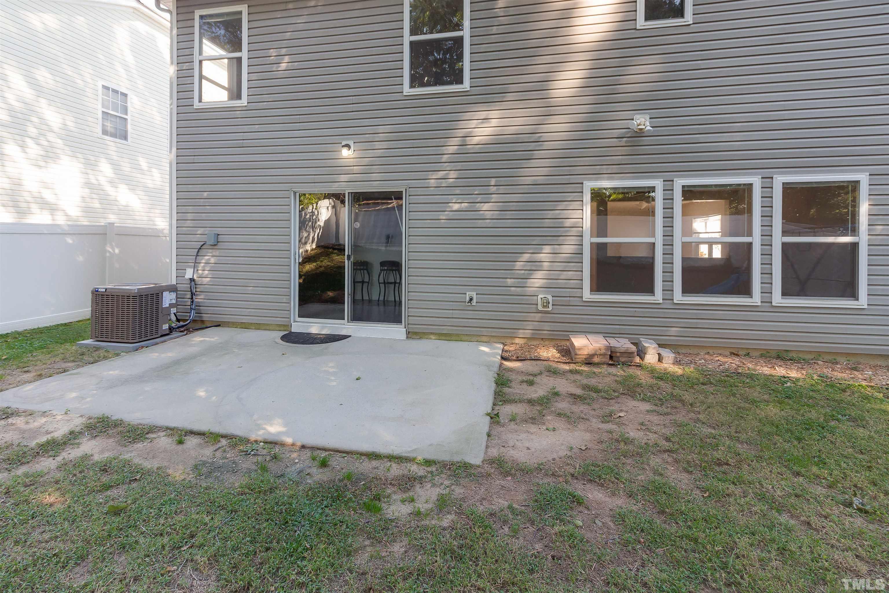 2824 Roundleaf Court Raleigh, NC 27604 - Photo 27 of 35 a view of a brick house with many windows