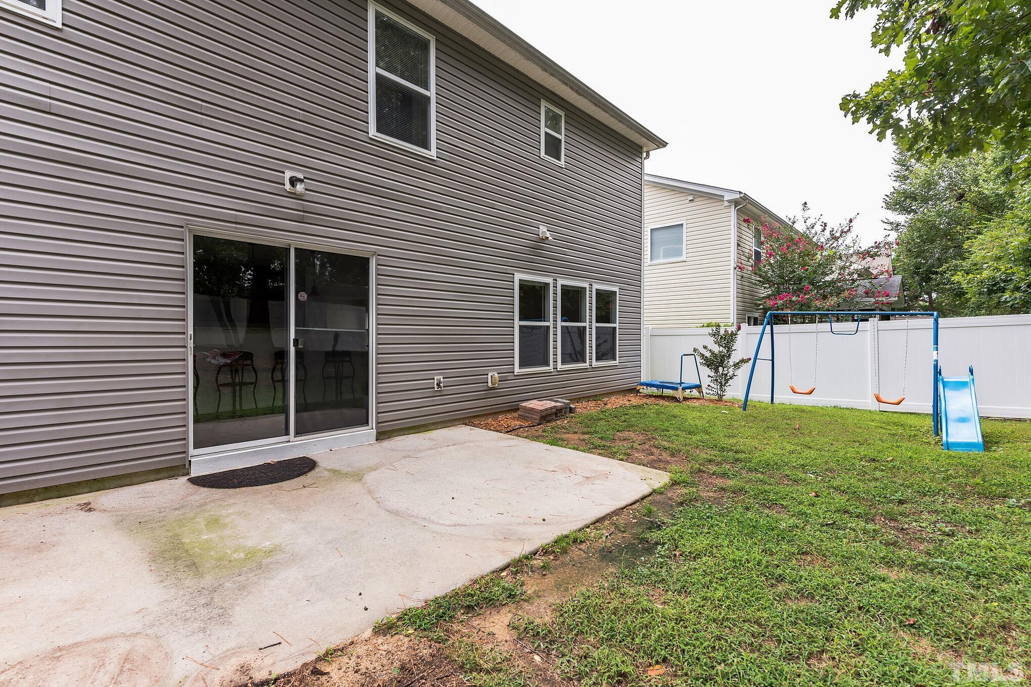 2824 Roundleaf Court Raleigh, NC 27604 - Photo 3 of 35 a front view of a house with a yard and garage