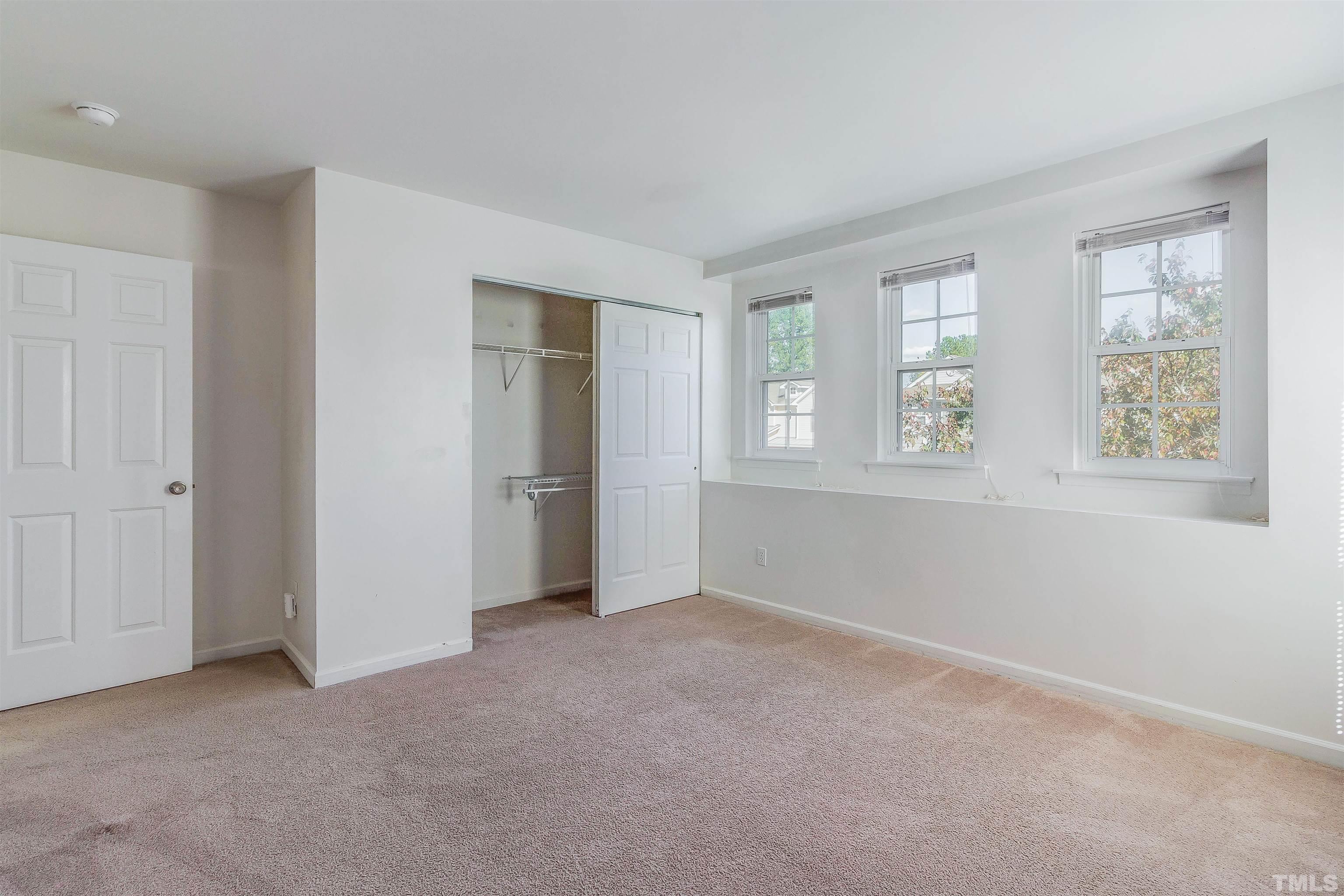 2824 Roundleaf Court Raleigh, NC 27604 - Photo 32 of 35 an empty room with windows and closet