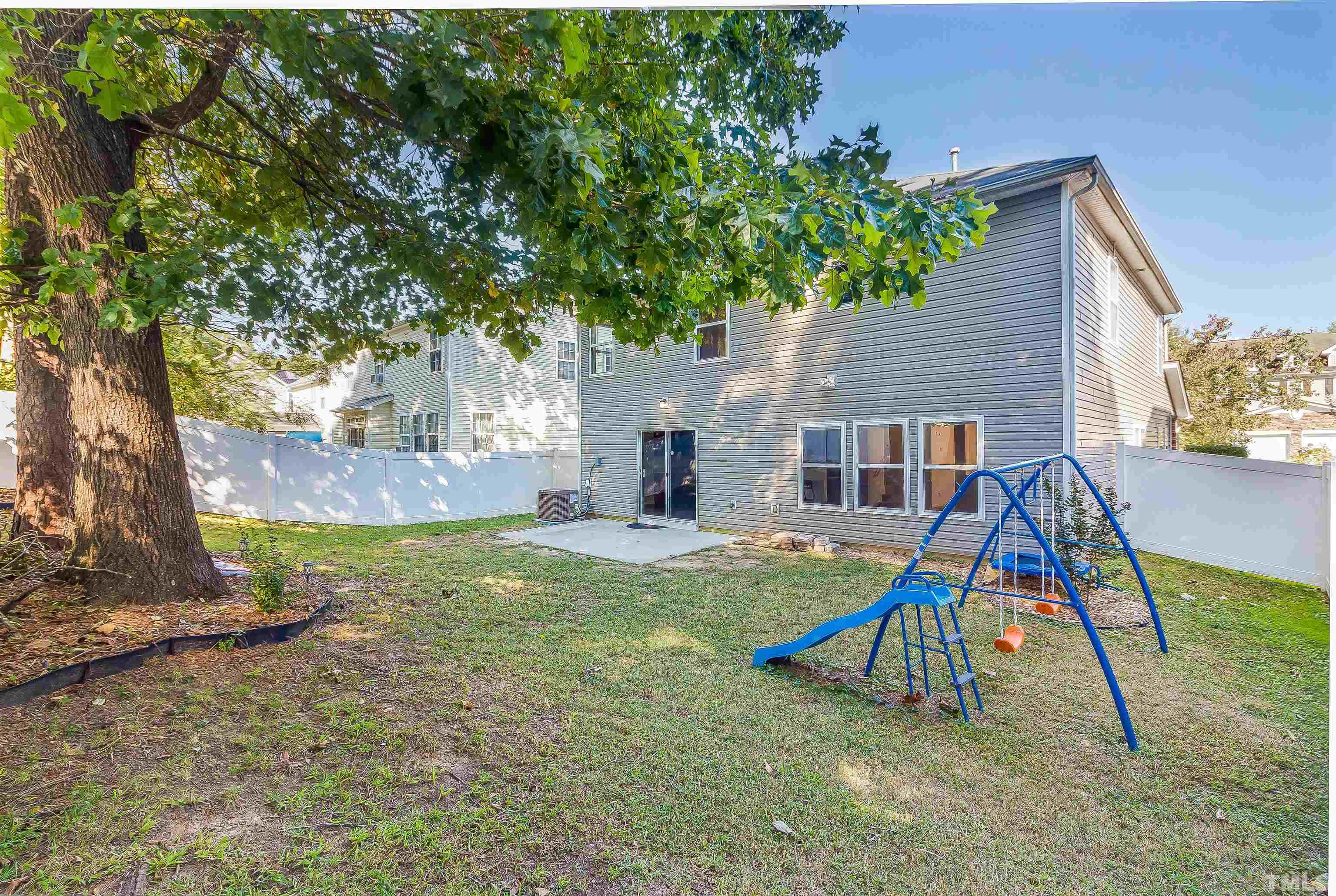 2824 Roundleaf Court Raleigh, NC 27604 - Photo 33 of 35 a view of a house with a backyard and a tree