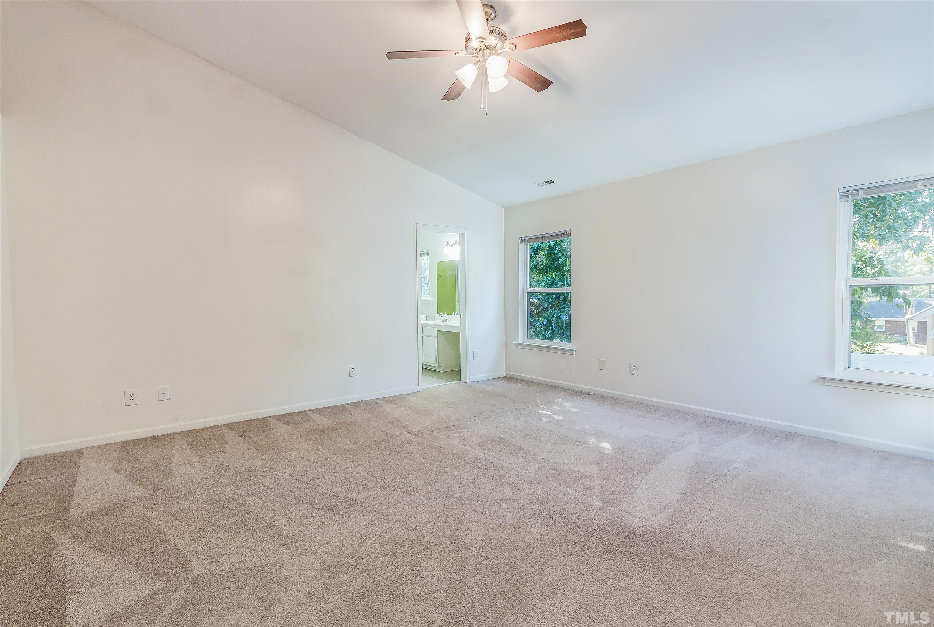 2824 Roundleaf Court Raleigh, NC 27604 - Photo 34 of 35 an empty room with windows and fan