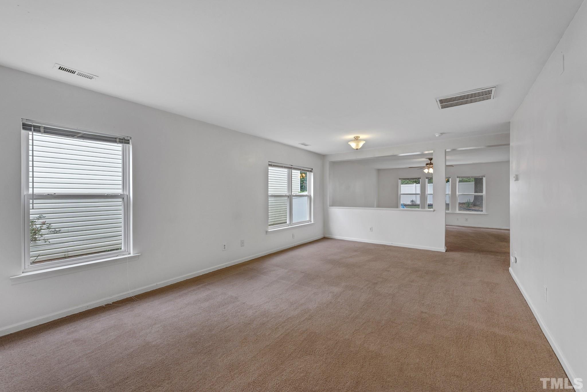 2824 Roundleaf Court Raleigh, NC 27604 - Photo 5 of 35 a view of a big room with windows and cabinet