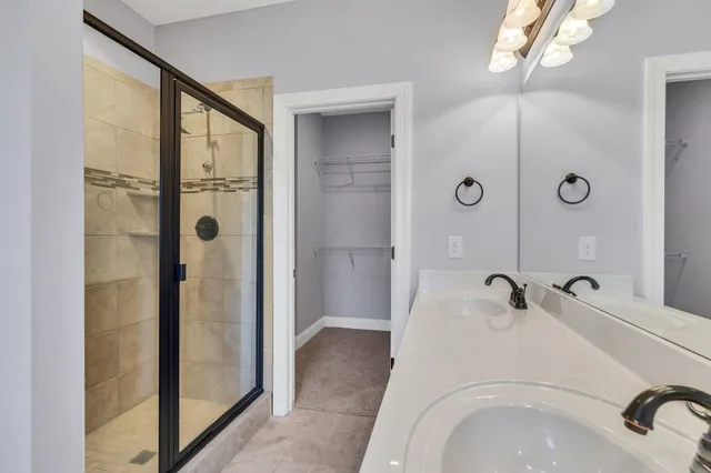 a bathroom with a tub and shower