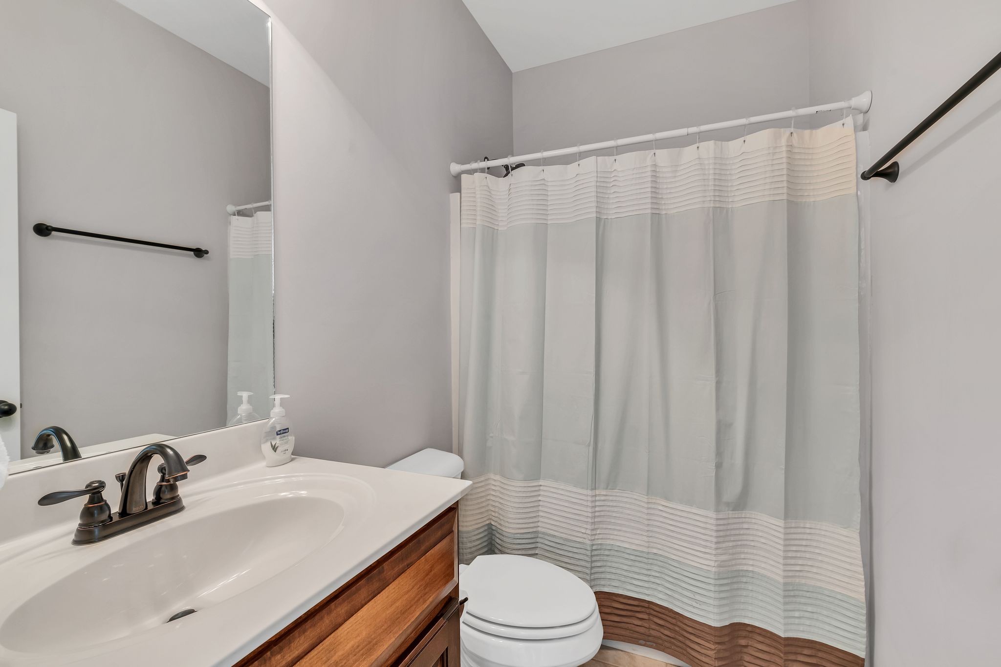 5502 Reflection Road Smyrna, TN 37167 - Photo 20 of 36 a bathroom with a sink a toilet and shower curtain