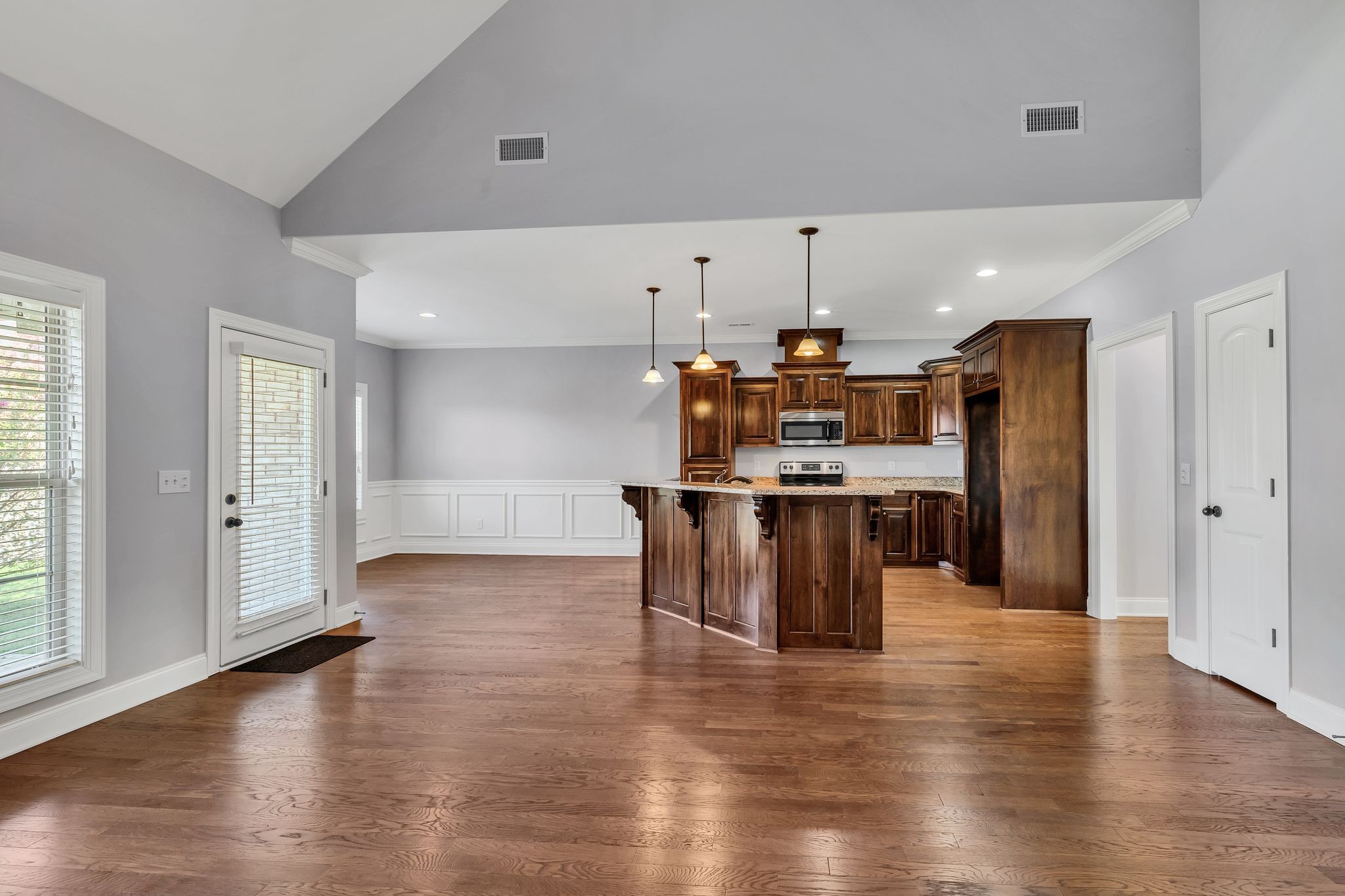 5502 Reflection Road Smyrna, TN 37167 - Photo 3 of 36 a kitchen with stainless steel appliances a refrigerator and wooden floor