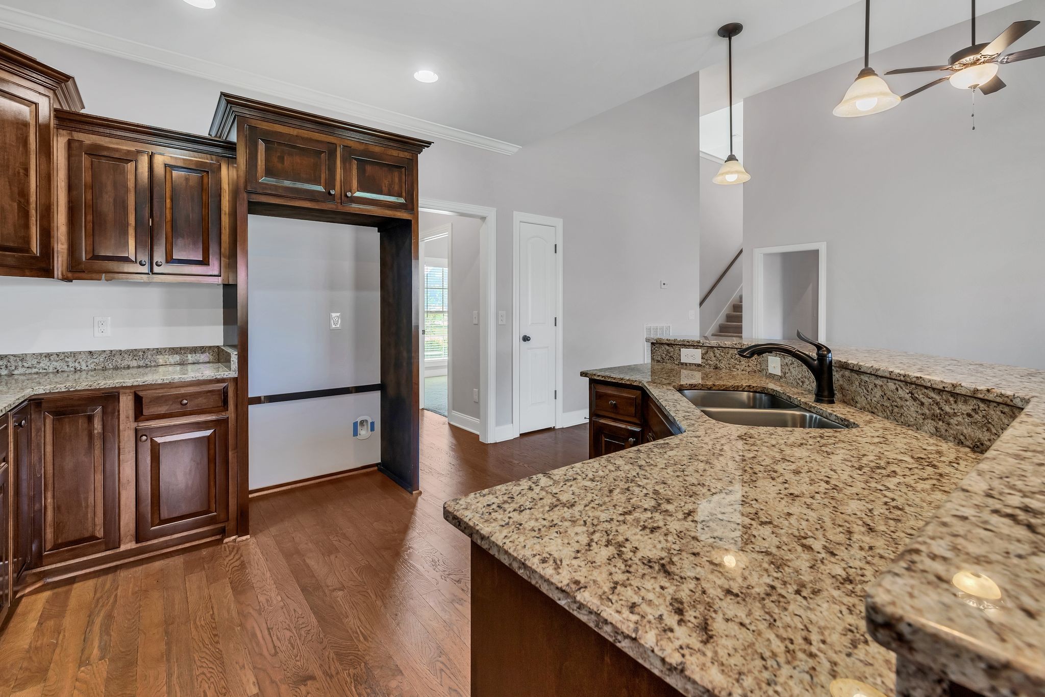 5502 Reflection Road Smyrna, TN 37167 - Photo 7 of 36 a kitchen with kitchen island a counter top space appliances and a refrigerator