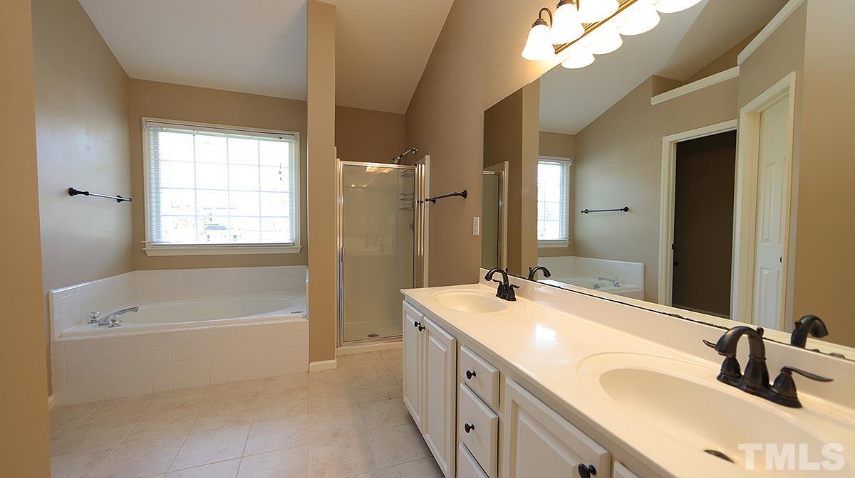 1203 Patterson Grove Road Apex, NC 27502 - Photo 8 of 11 Bathroom features garden tub, separate shower and double vanity.