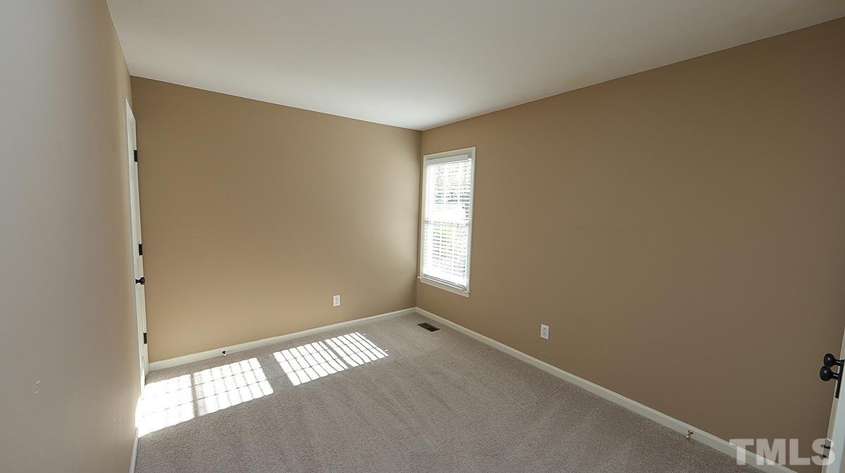 1203 Patterson Grove Road Apex, NC 27502 - Photo 10 of 11 Two secondary bedrooms are across family room from primary bedroom.