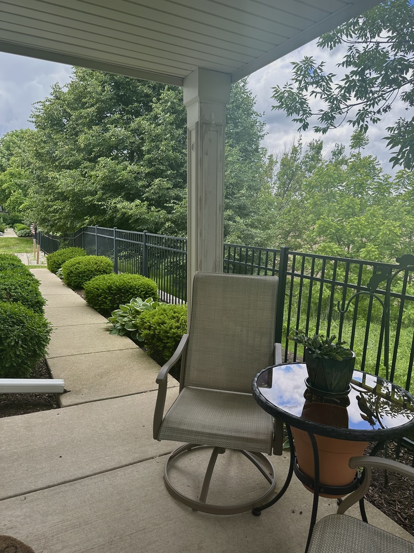 58 Rolling Oaks Road Sugar Grove, IL 60554 - Photo 3 of 23 a view of a porch with furniture