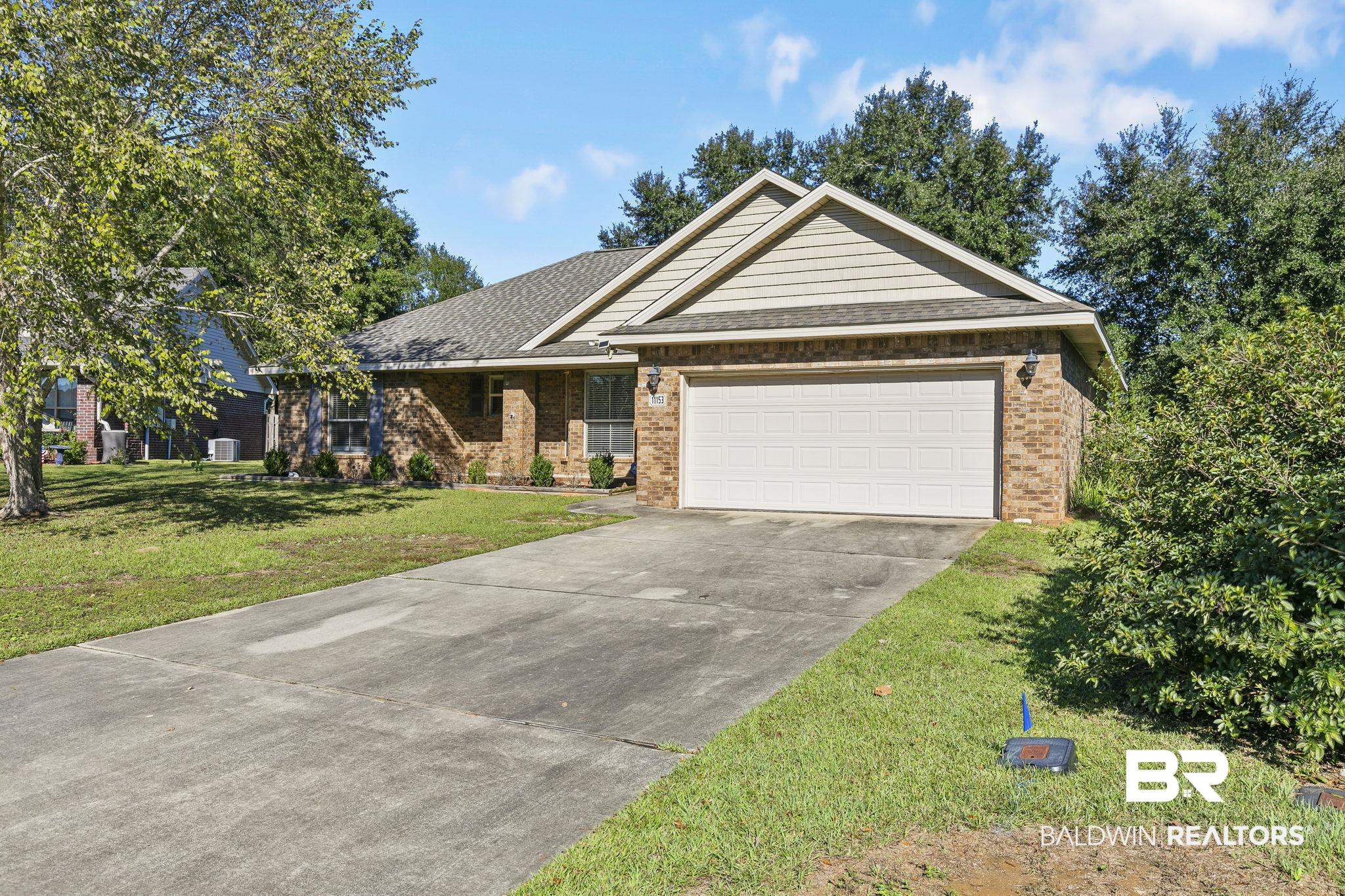 11153 Sturbridge Loop Daphne, AL 36526 - Photo 4 of 79 View of front facade featuring a front yard and a garage