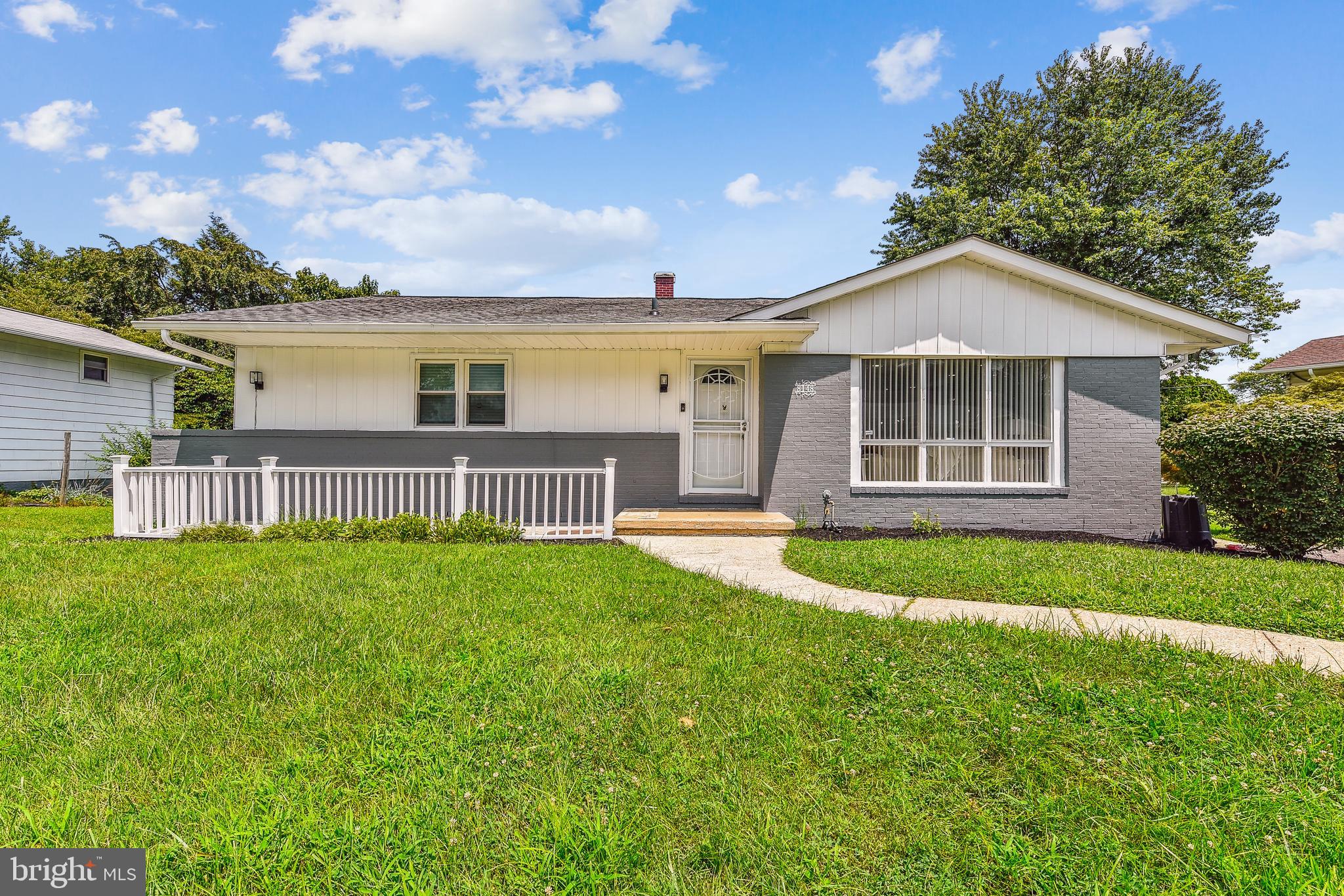 8148 Scotts Level Road Pikesville, MD 21208 - Photo 1 of 36 a view of a house with a yard and front view of a house