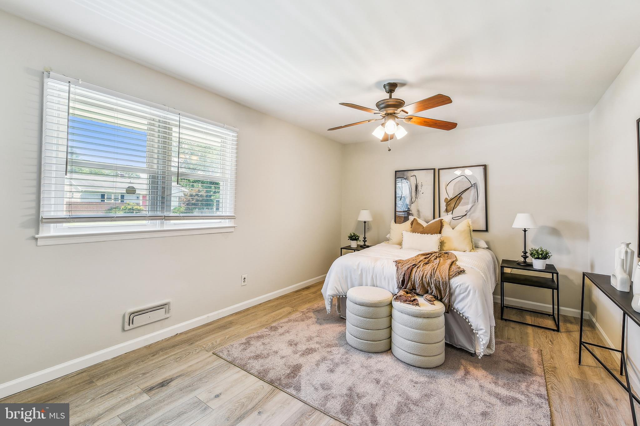 8148 Scotts Level Road Pikesville, MD 21208 - Photo 15 of 36 a bed room with furniture and a window