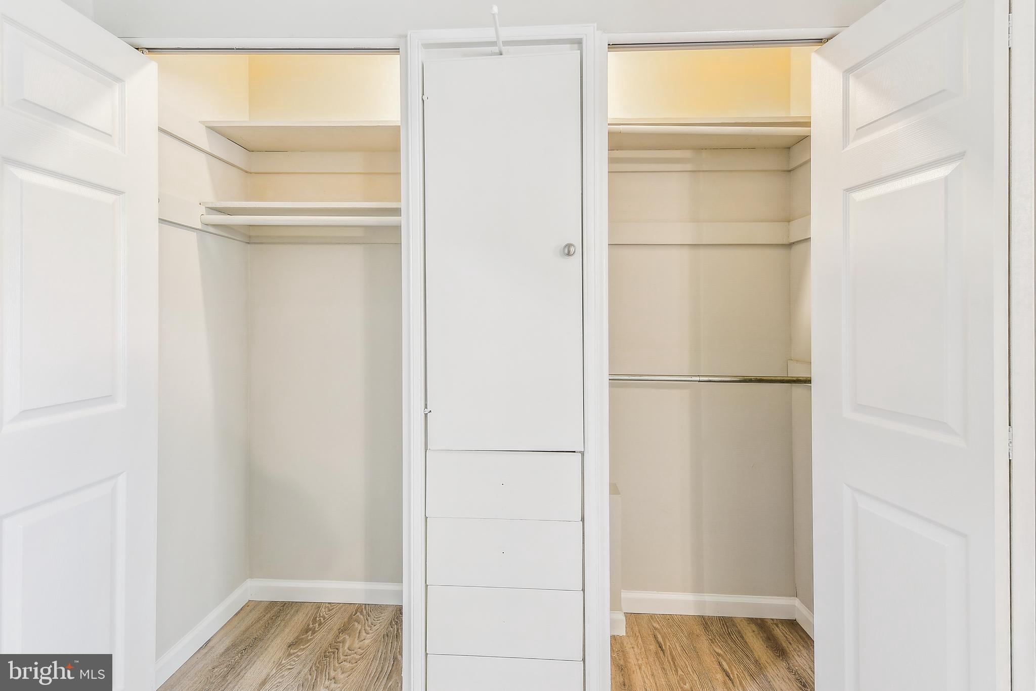 8148 Scotts Level Road Pikesville, MD 21208 - Photo 18 of 36 a view of walk in closet with empty racks