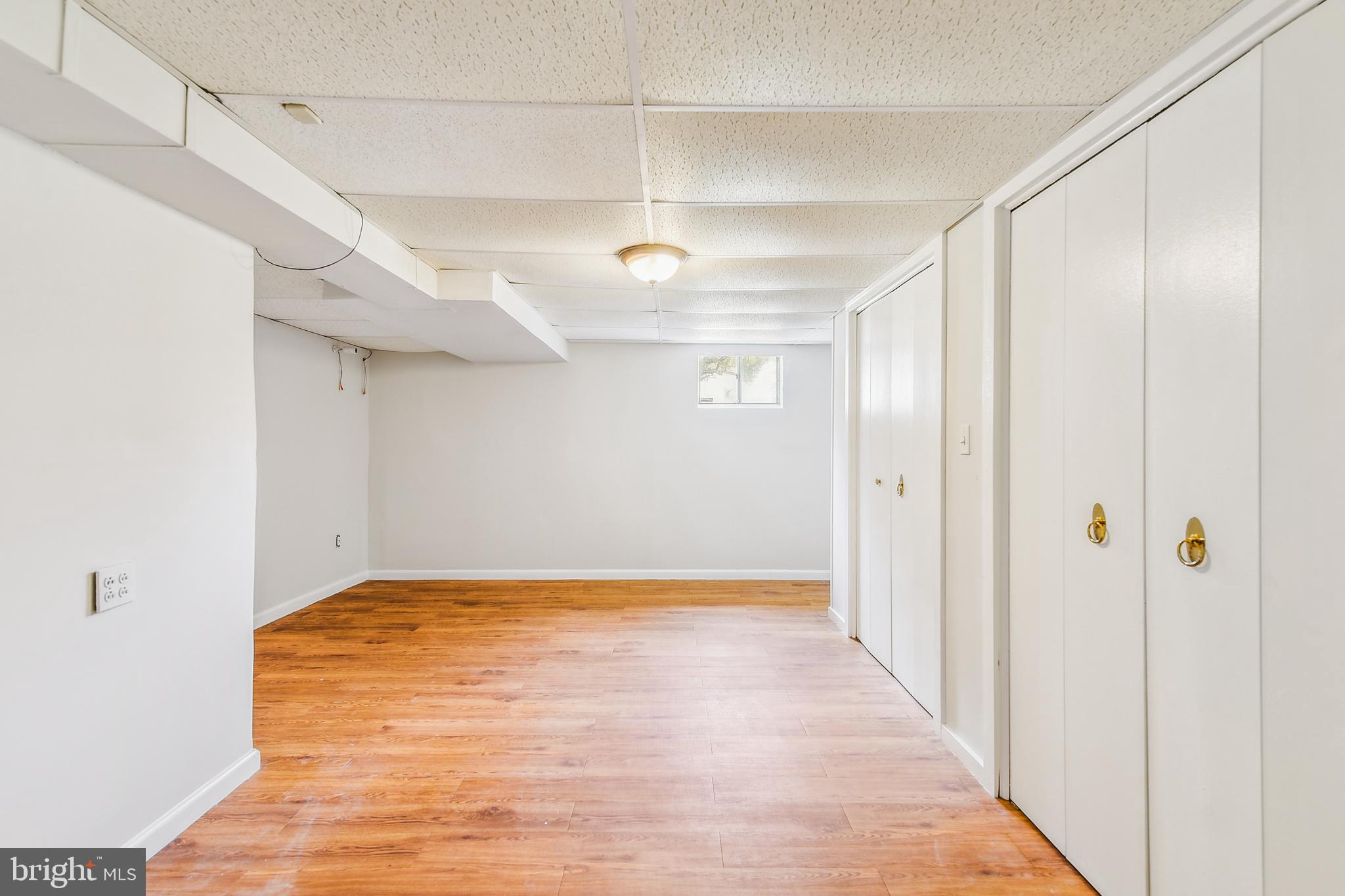 8148 Scotts Level Road Pikesville, MD 21208 - Photo 29 of 36 a view of hallway with a ceiling fan