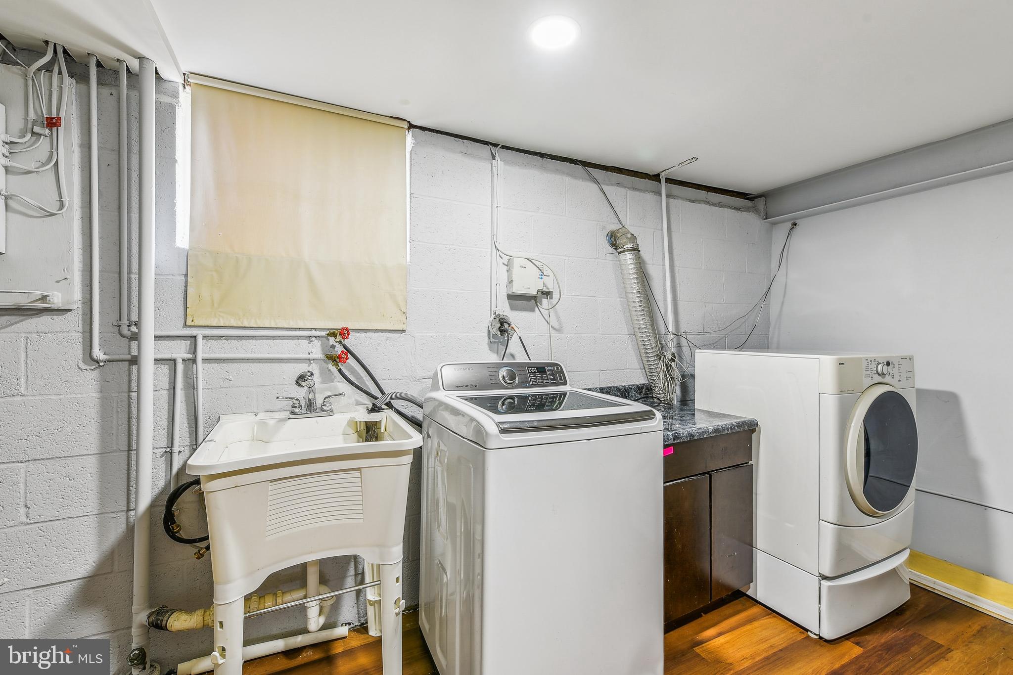 8148 Scotts Level Road Pikesville, MD 21208 - Photo 32 of 36 a utility room with dryer and washer