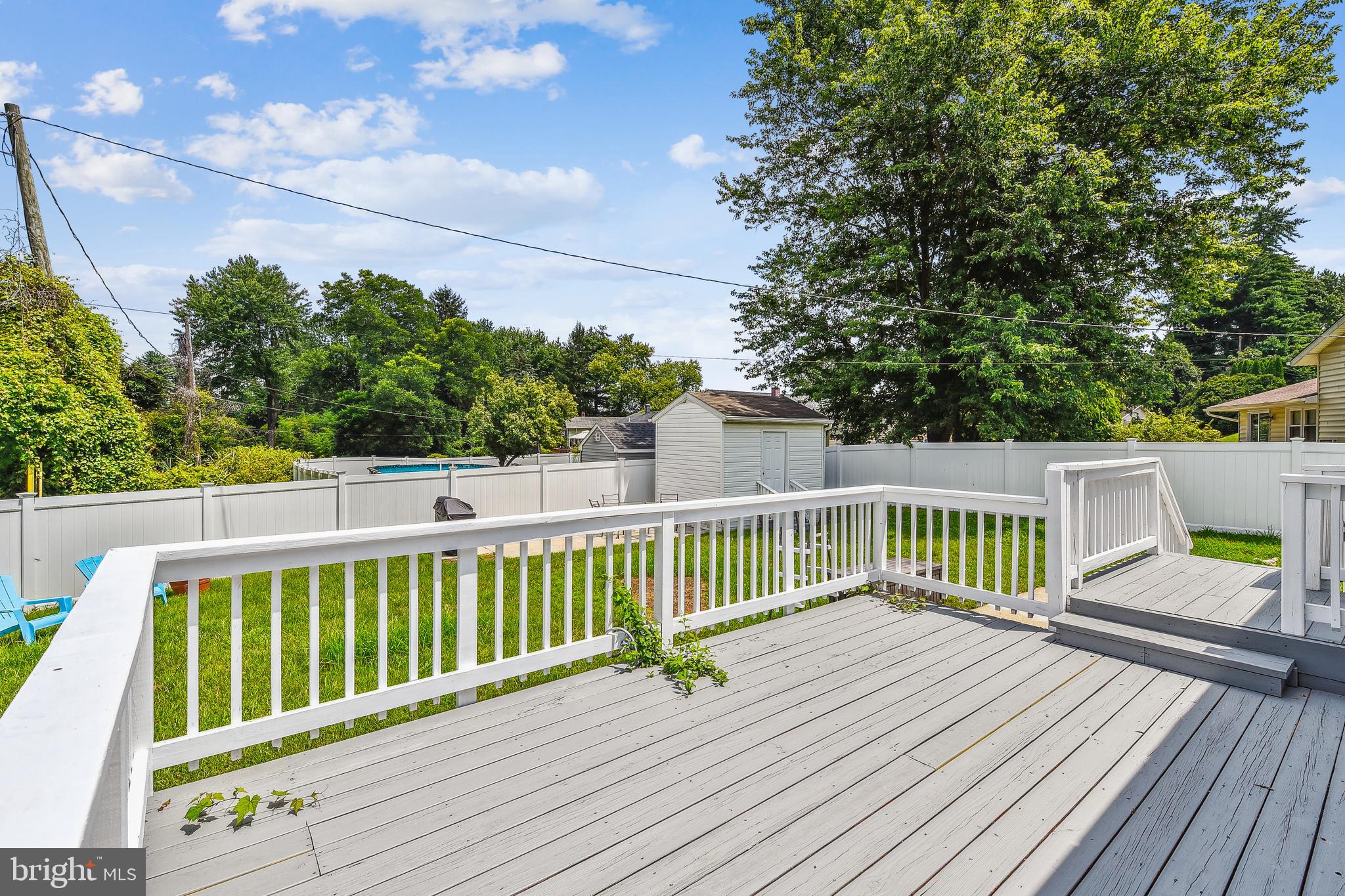 8148 Scotts Level Road Pikesville, MD 21208 - Photo 33 of 36 a view of a deck with wooden floor and fence