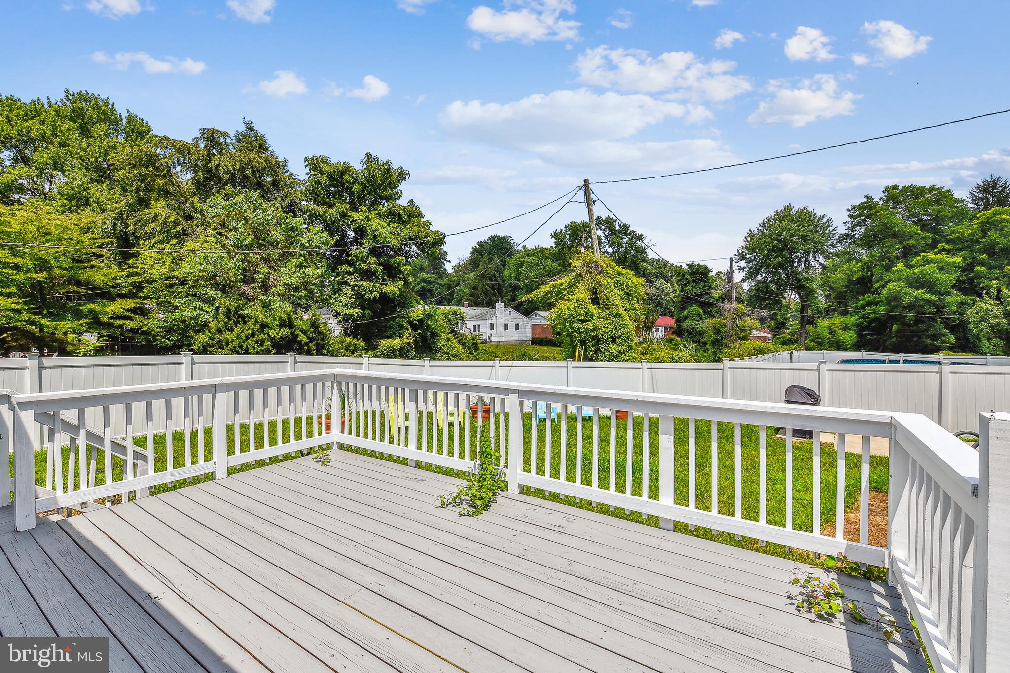 8148 Scotts Level Road Pikesville, MD 21208 - Photo 34 of 36 a view of balcony with wooden floor and fence