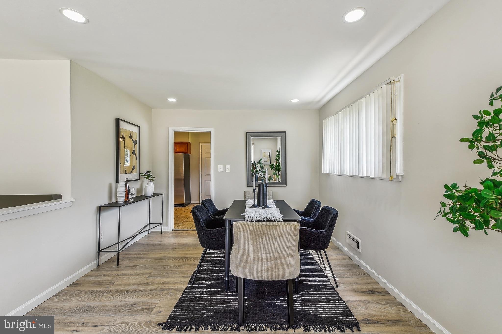 8148 Scotts Level Road Pikesville, MD 21208 - Photo 6 of 36 a dining room with furniture and wooden floor