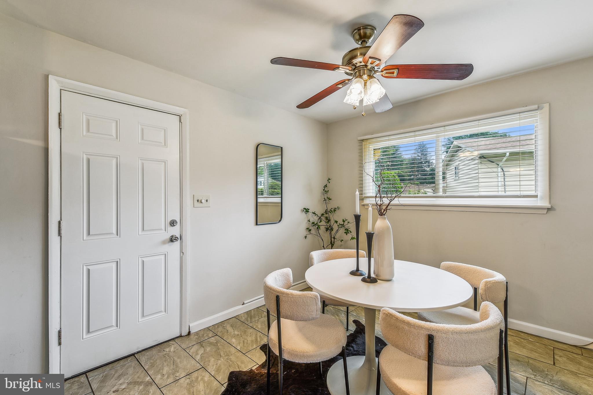 8148 Scotts Level Road Pikesville, MD 21208 - Photo 10 of 36 a dining room with furniture and window