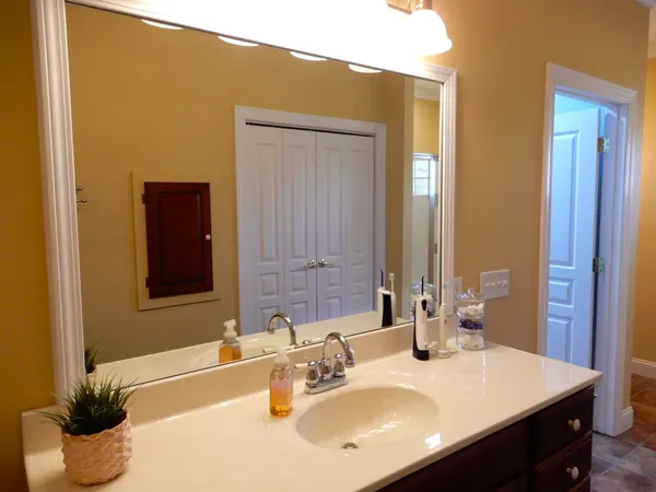 a kitchen with a sink a stove and cabinets
