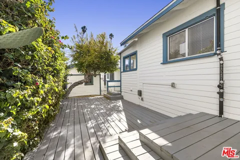 a view of a backyard with sitting area