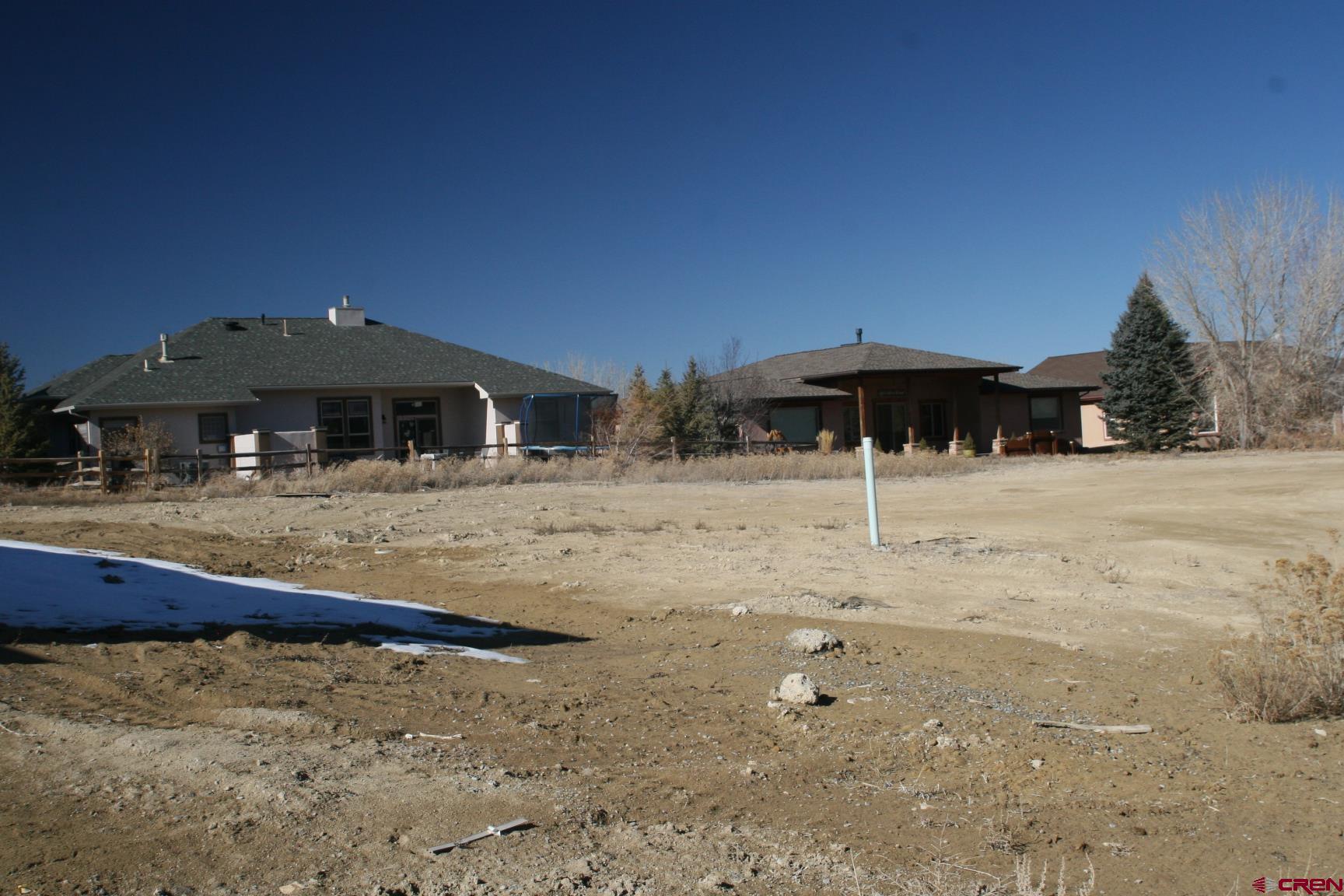 Tbd Mocha Court Montrose, CO 81401 - Photo 1 of 18 a front view of a house with large trees