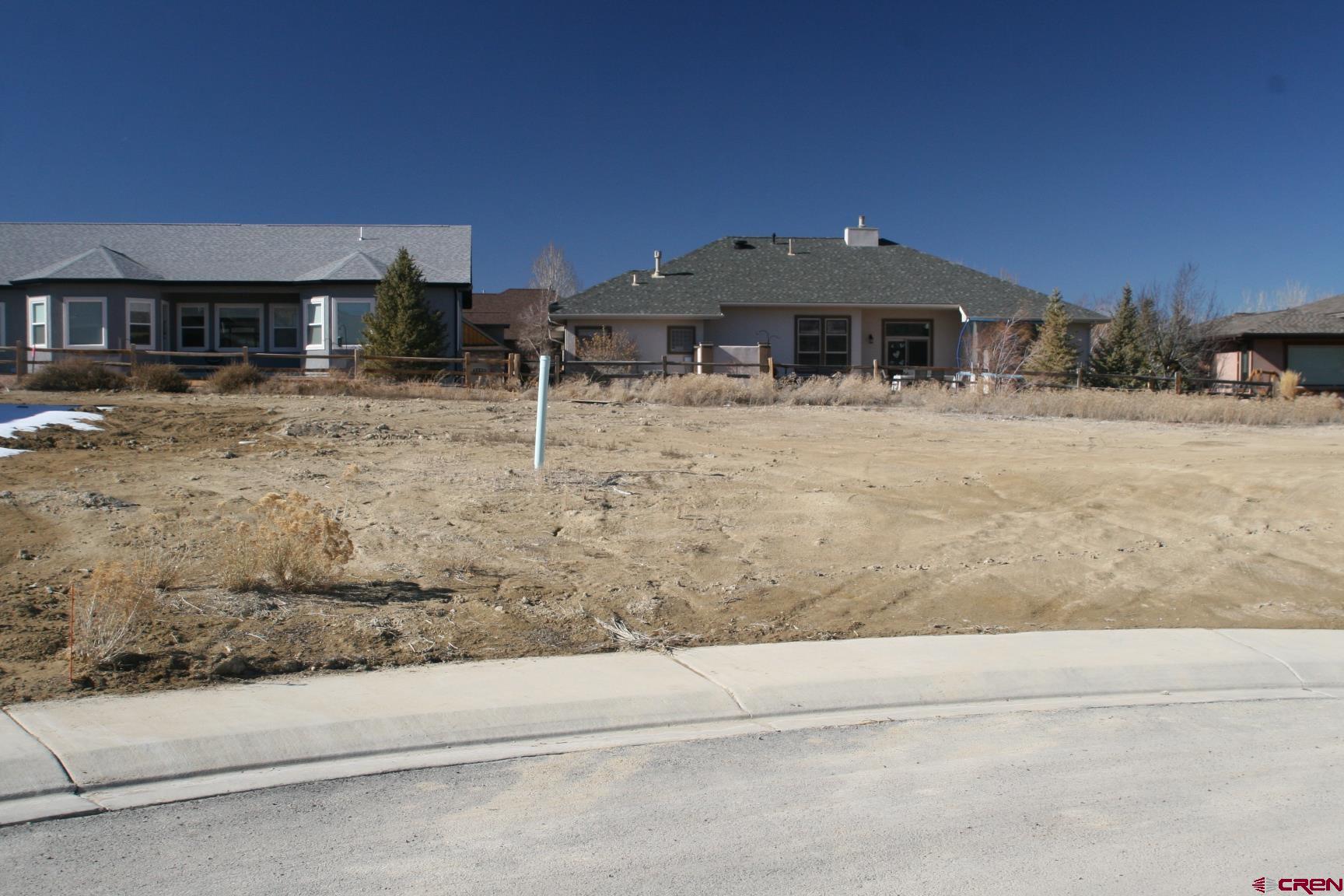Tbd Mocha Court Montrose, CO 81401 - Photo 12 of 18 a front view of a house with a yard