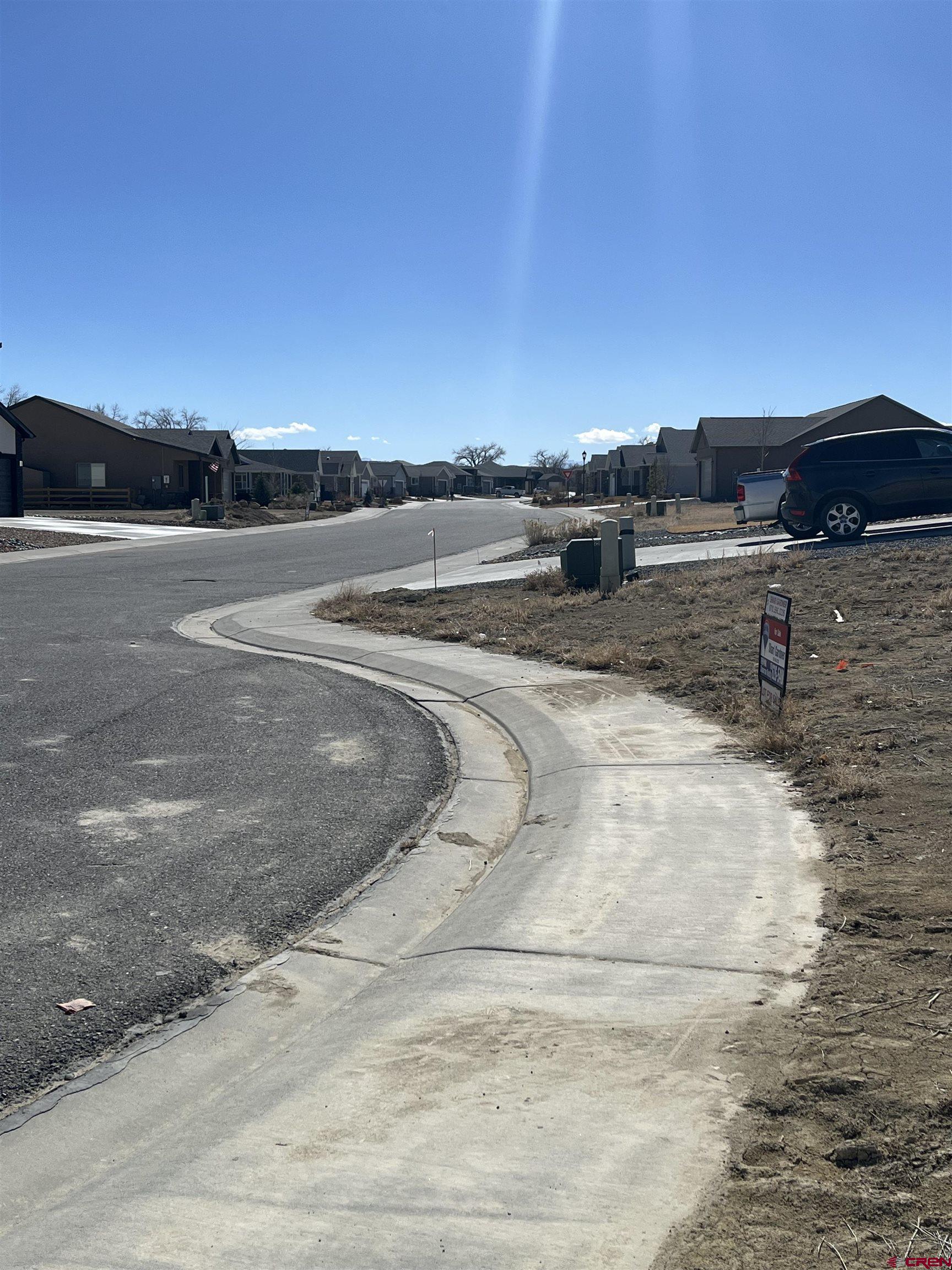 Tbd Mocha Court Montrose, CO 81401 - Photo 16 of 18 a view of a dry yard with wooden fence