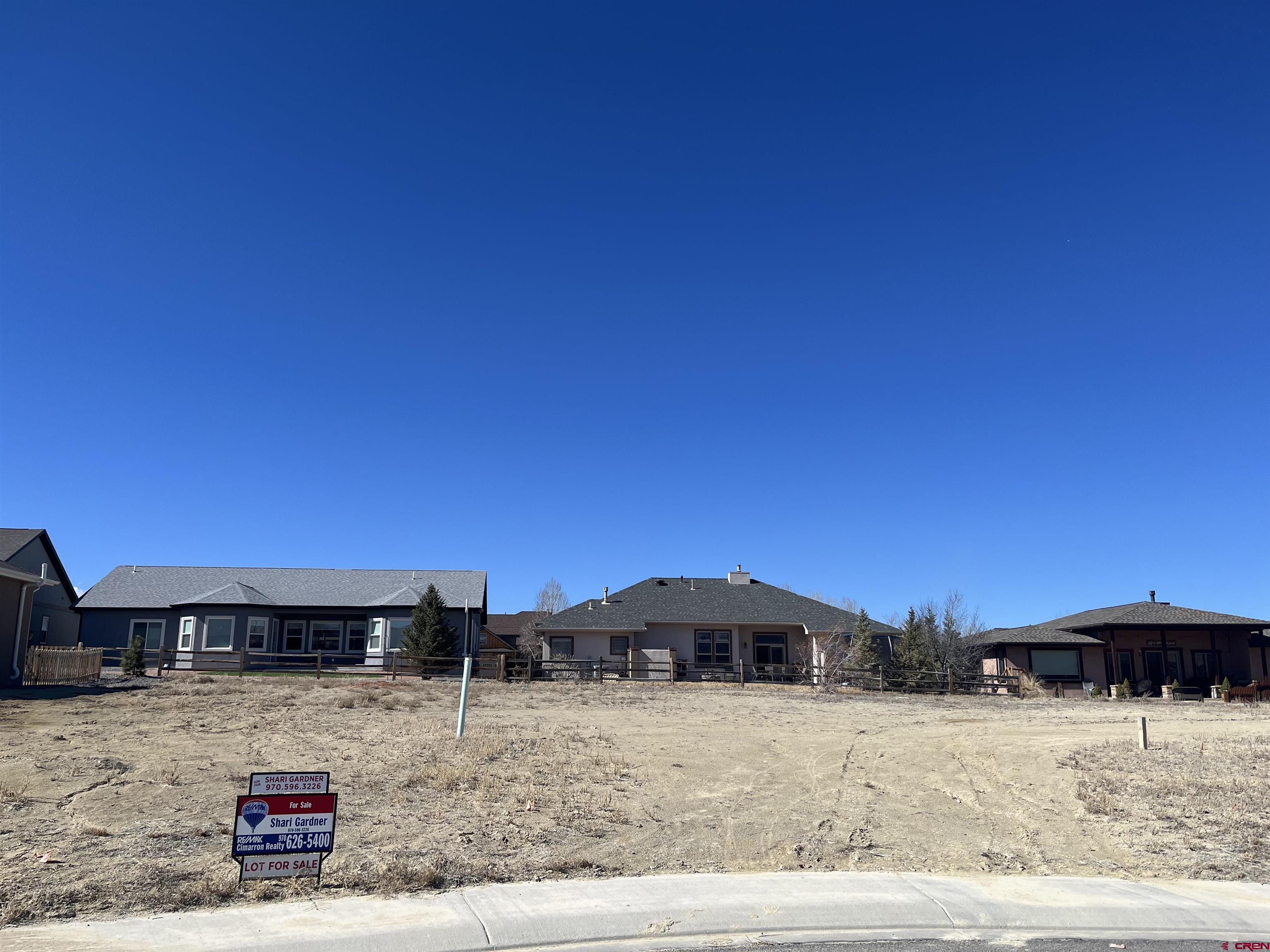 Tbd Mocha Court Montrose, CO 81401 - Photo 17 of 18 a view of a house with a yard