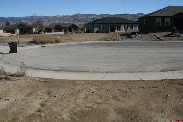 a view of houses with outdoor space and lakeside
