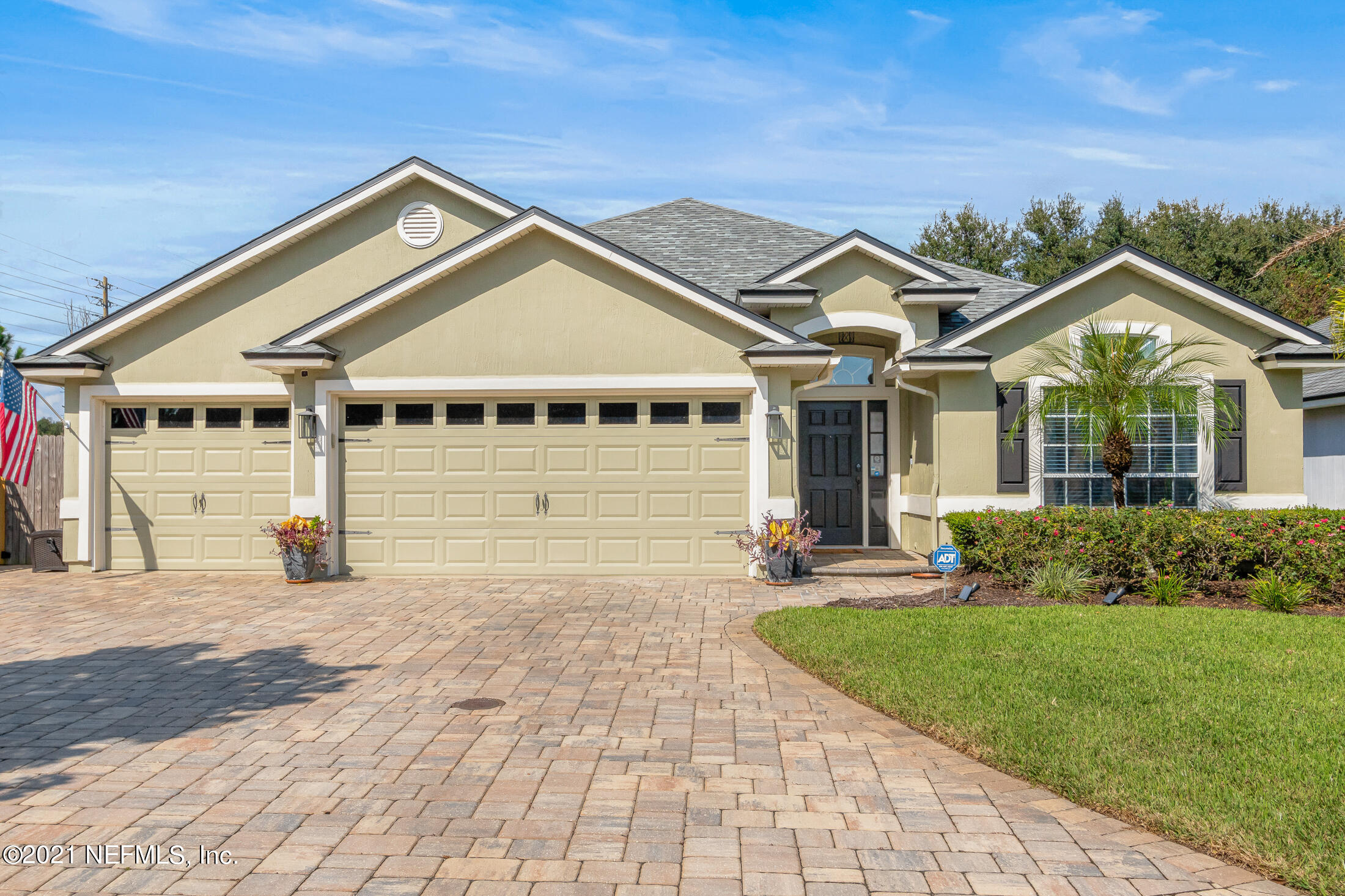 856 Crystal Spring Way St. Augustine, FL 32092 - Photo 1 of 54 a front view of a house with a yard and garage
