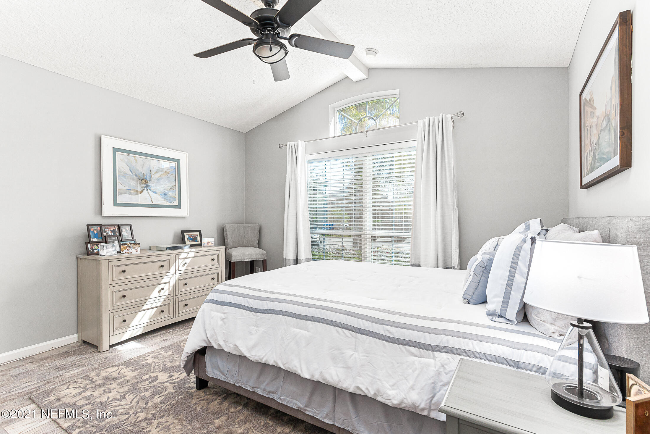 856 Crystal Spring Way St. Augustine, FL 32092 - Photo 19 of 54 a bedroom with a bed and a window
