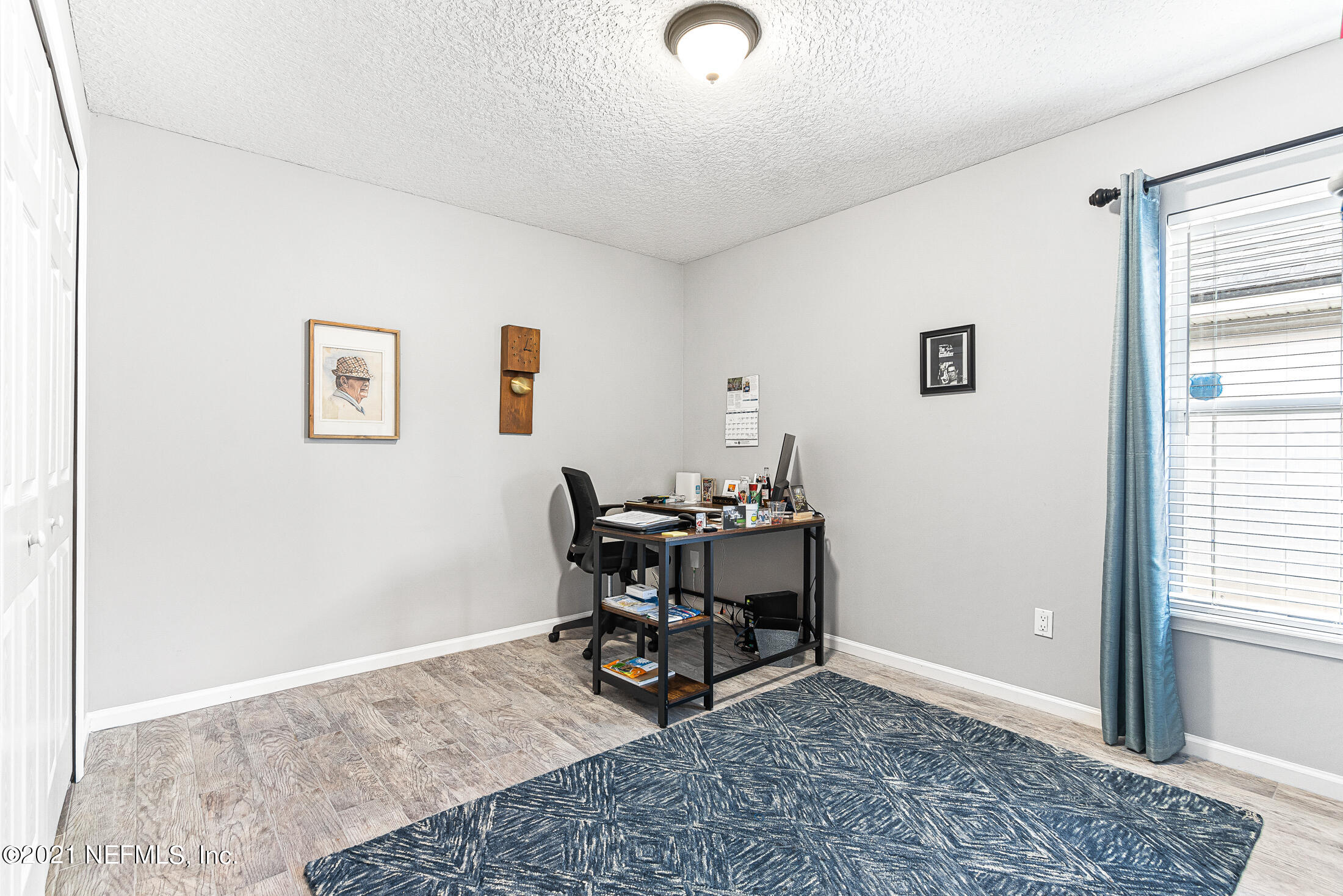 856 Crystal Spring Way St. Augustine, FL 32092 - Photo 22 of 54 a view of a workspace with furniture and a window