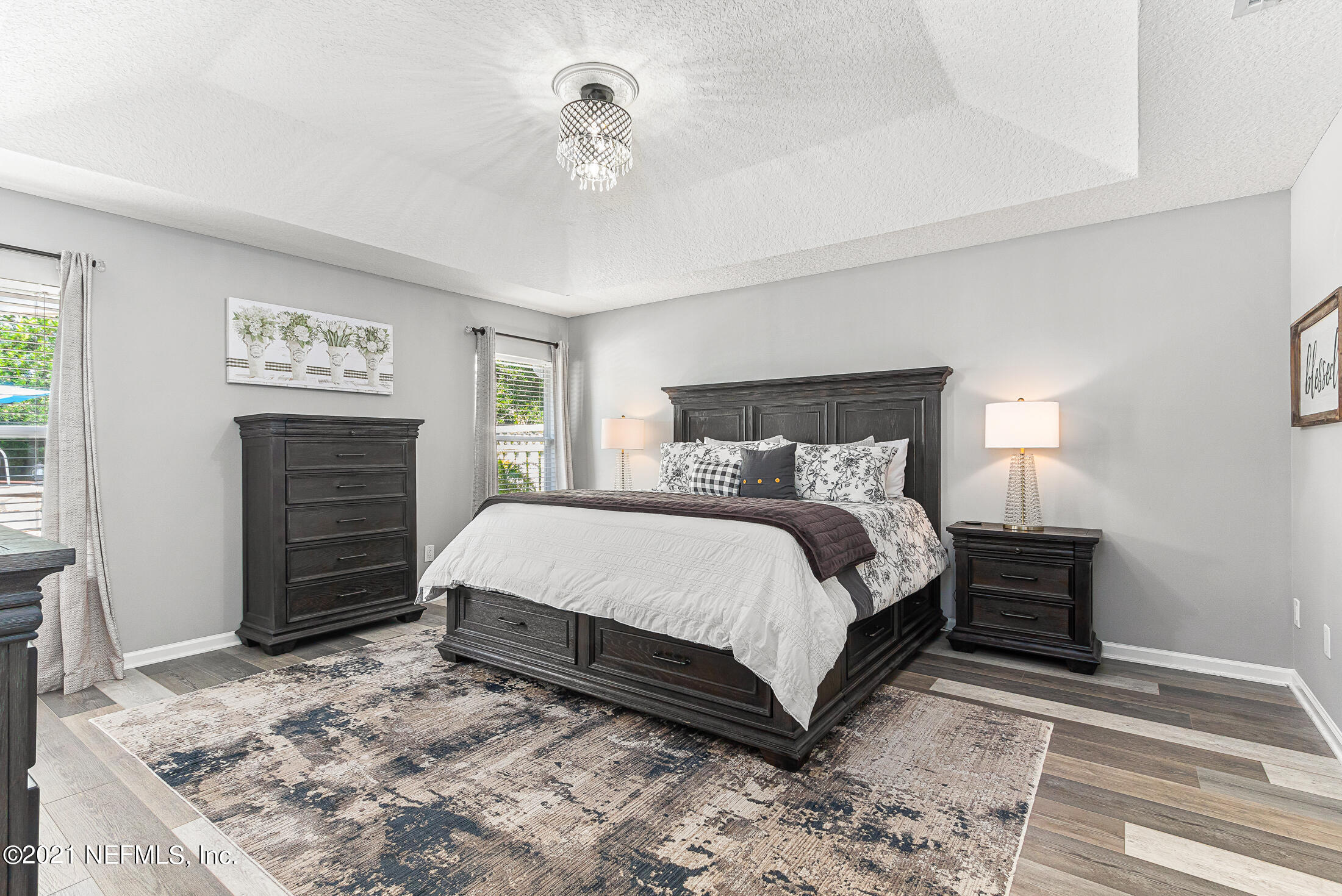 856 Crystal Spring Way St. Augustine, FL 32092 - Photo 27 of 54 a bedroom with a bed and a television