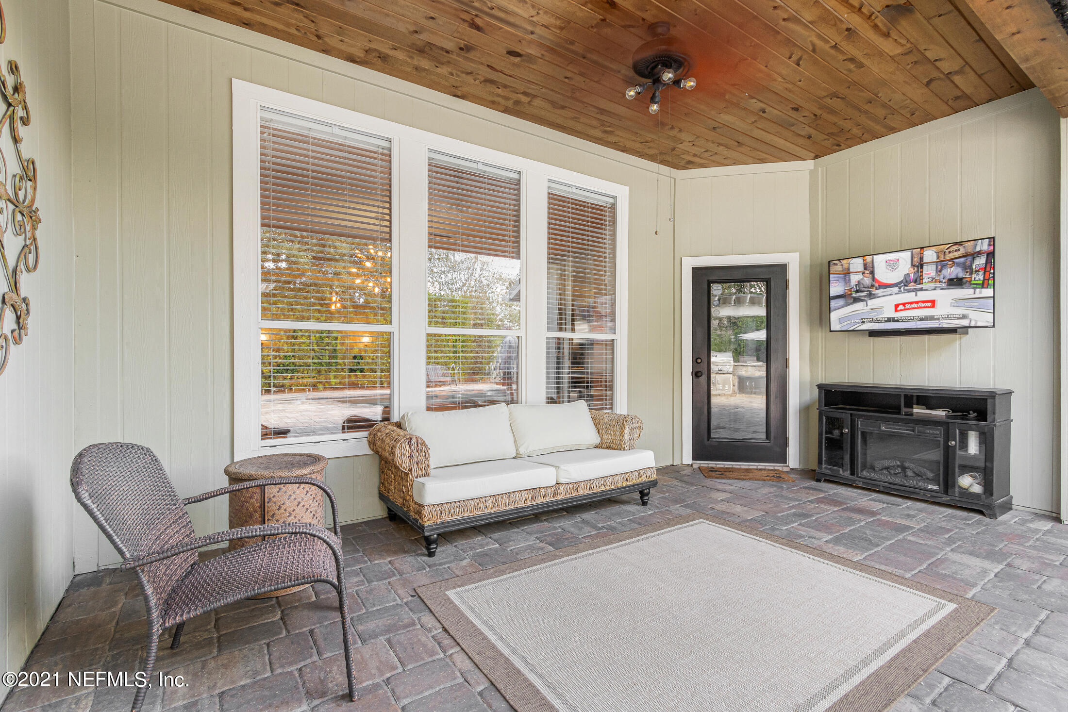 856 Crystal Spring Way St. Augustine, FL 32092 - Photo 34 of 54 a living room with furniture and a fireplace