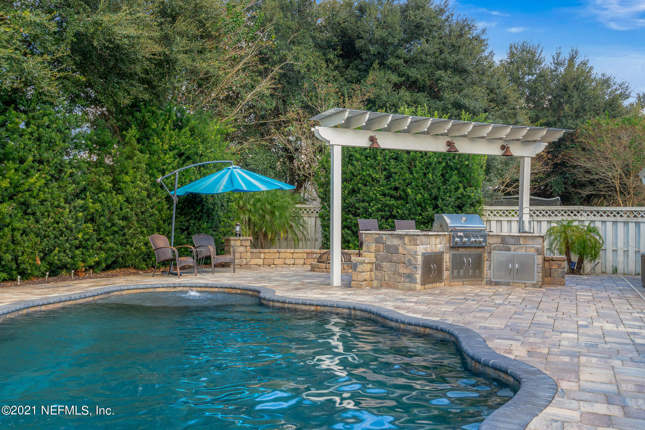 856 Crystal Spring Way St. Augustine, FL 32092 - Photo 38 of 54 a view of a swimming pool with a patio