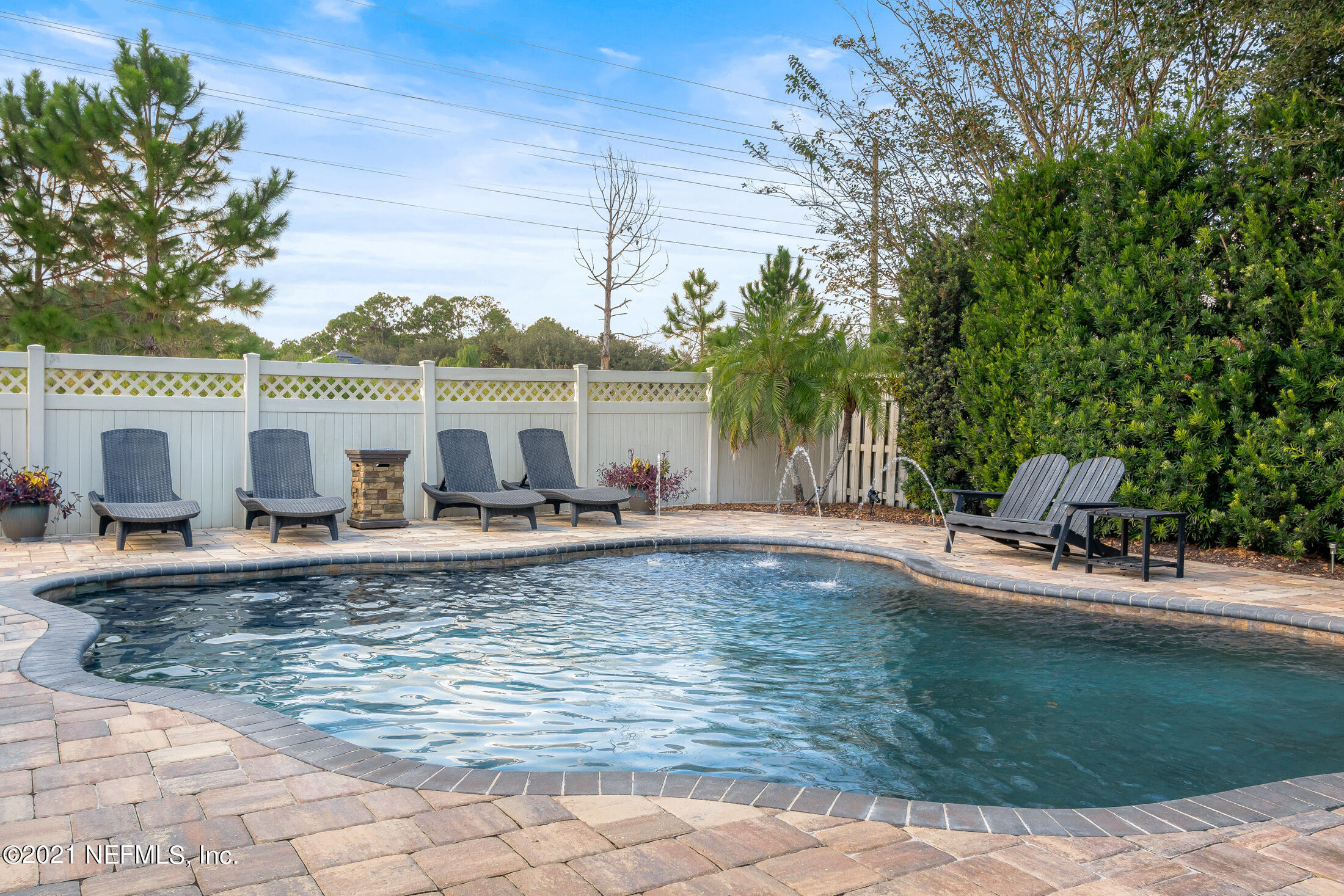 856 Crystal Spring Way St. Augustine, FL 32092 - Photo 41 of 54 a view of a swimming pool with a patio
