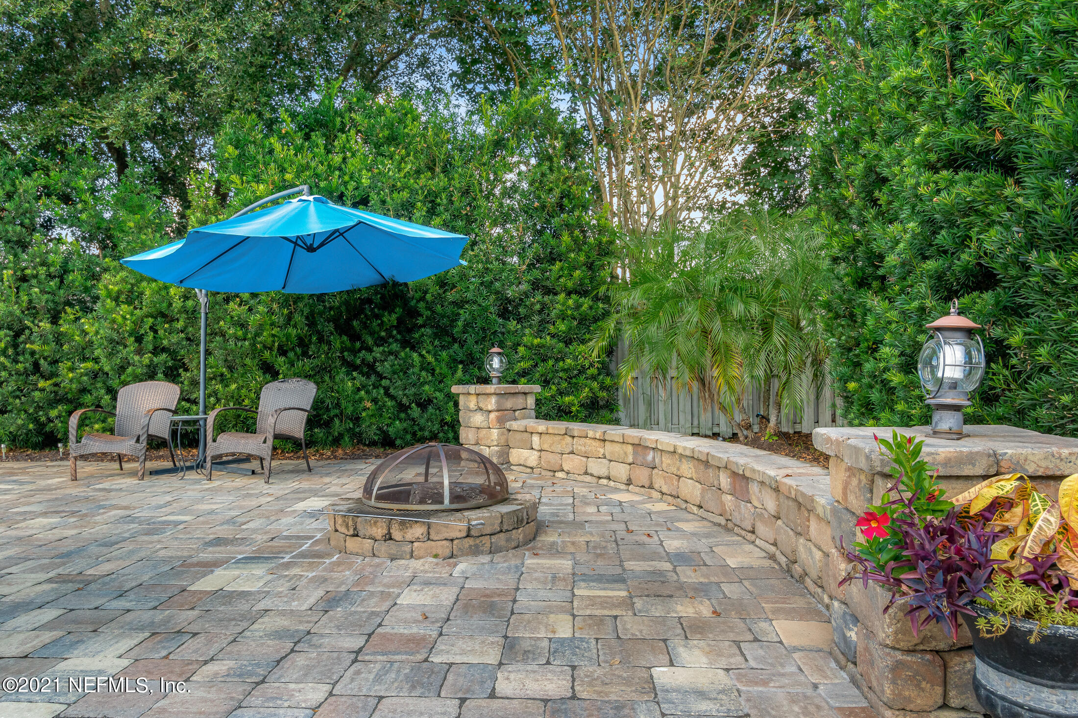 856 Crystal Spring Way St. Augustine, FL 32092 - Photo 43 of 54 a view of a chair and table in the backyard