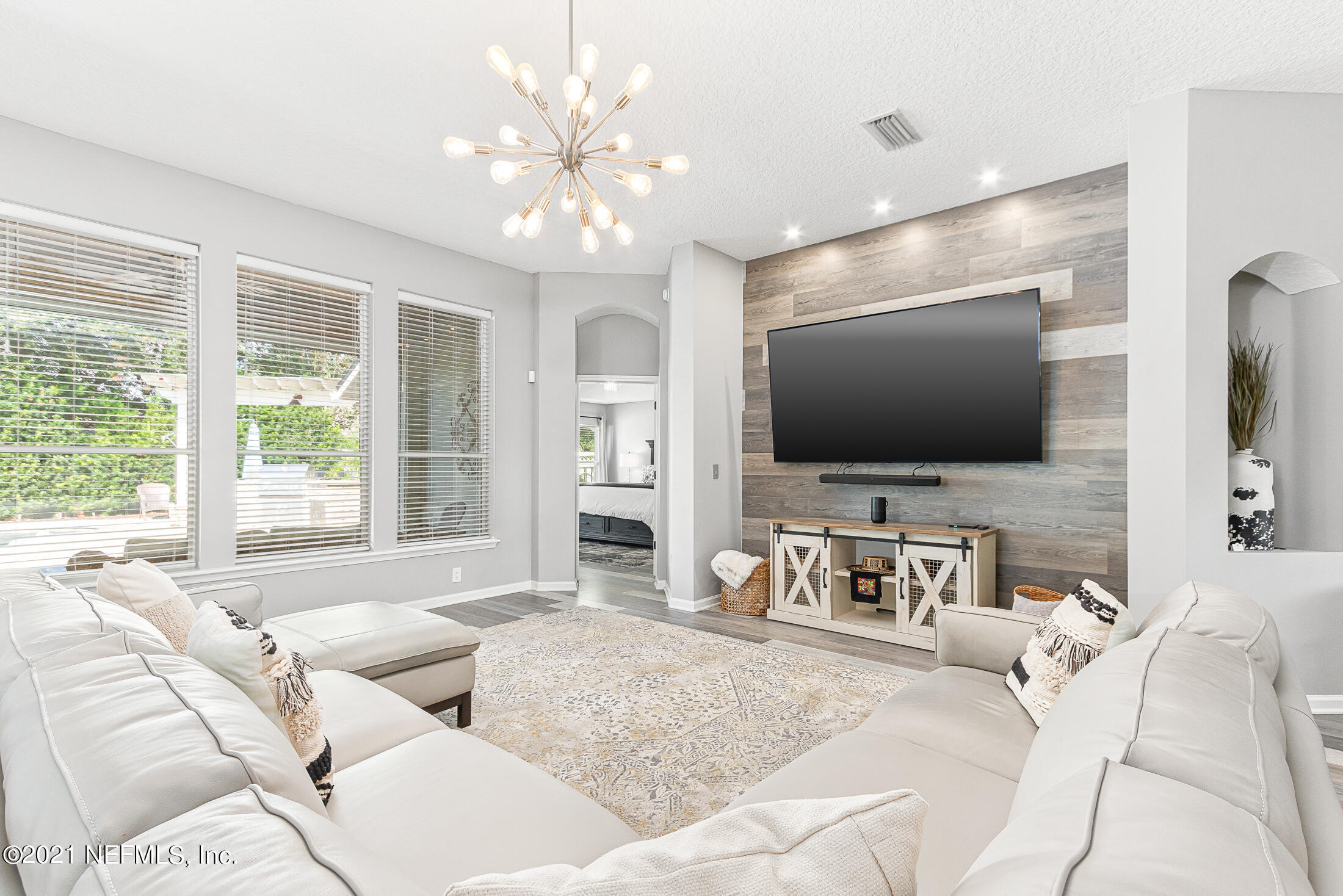 856 Crystal Spring Way St. Augustine, FL 32092 - Photo 6 of 54 a living room with furniture and a flat screen tv