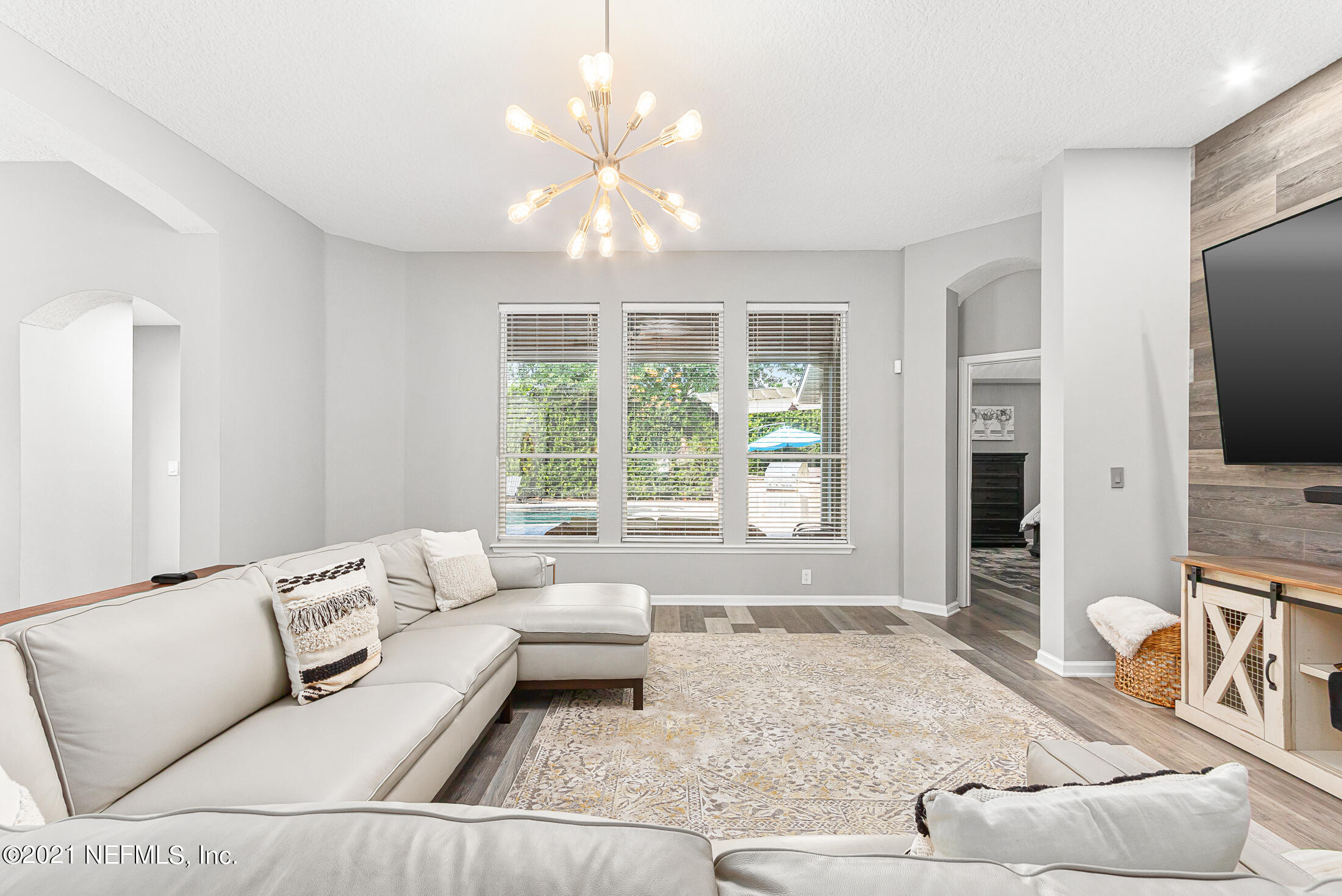 856 Crystal Spring Way St. Augustine, FL 32092 - Photo 8 of 54 a living room with furniture and a large window